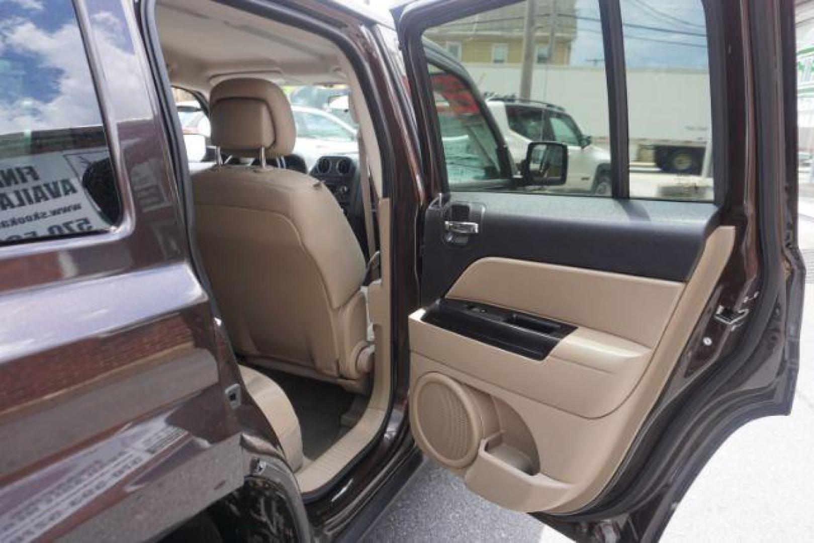 2014 Rugged Brown Pearlcoat /Light Pebble Beige/Dk Slate Jeep Patriot Latitude 4WD (1C4NJRFB3ED) with an 2.4L L4 DOHC 16V engine, Continuously Variable Transmission transmission, located at 312 Centre Ave, Schuylkill Haven, PA, 17972, (570) 593-5278, 40.638130, -76.177383 - Boston Accoustics stereo, locking/limited slip differential, power sunroof - Photo#38