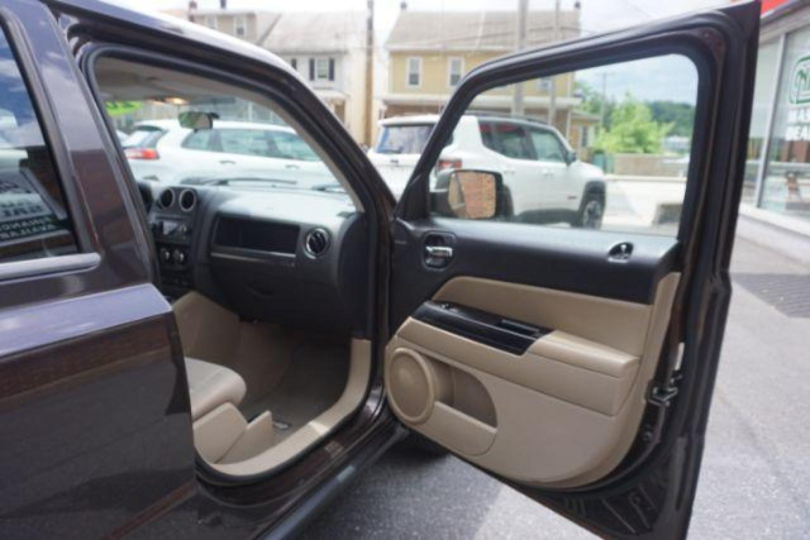 2014 Rugged Brown Pearlcoat /Light Pebble Beige/Dk Slate Jeep Patriot Latitude 4WD (1C4NJRFB3ED) with an 2.4L L4 DOHC 16V engine, Continuously Variable Transmission transmission, located at 312 Centre Ave, Schuylkill Haven, PA, 17972, (570) 593-5278, 40.638130, -76.177383 - Boston Accoustics stereo, locking/limited slip differential, power sunroof - Photo#43