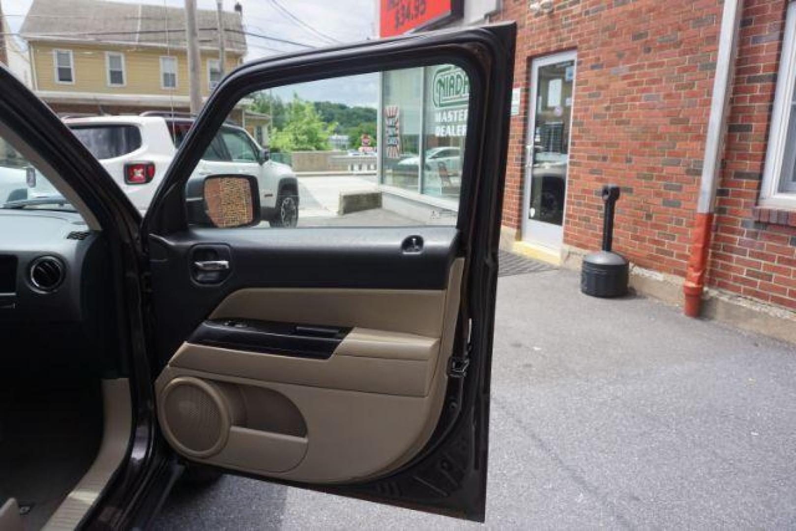 2014 Rugged Brown Pearlcoat /Light Pebble Beige/Dk Slate Jeep Patriot Latitude 4WD (1C4NJRFB3ED) with an 2.4L L4 DOHC 16V engine, Continuously Variable Transmission transmission, located at 312 Centre Ave, Schuylkill Haven, PA, 17972, (570) 593-5278, 40.638130, -76.177383 - Boston Accoustics stereo, locking/limited slip differential, power sunroof - Photo#44