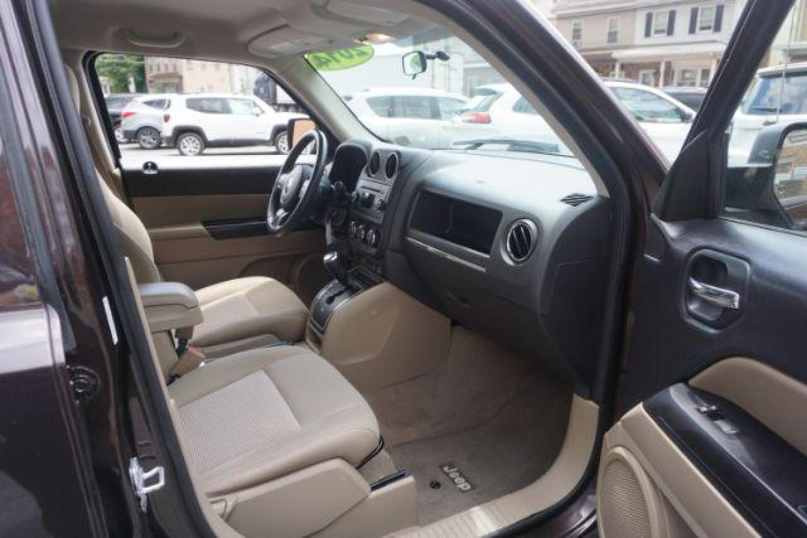 2014 Rugged Brown Pearlcoat /Light Pebble Beige/Dk Slate Jeep Patriot Latitude 4WD (1C4NJRFB3ED) with an 2.4L L4 DOHC 16V engine, Continuously Variable Transmission transmission, located at 312 Centre Ave, Schuylkill Haven, PA, 17972, (570) 593-5278, 40.638130, -76.177383 - Boston Accoustics stereo, locking/limited slip differential, power sunroof - Photo#46