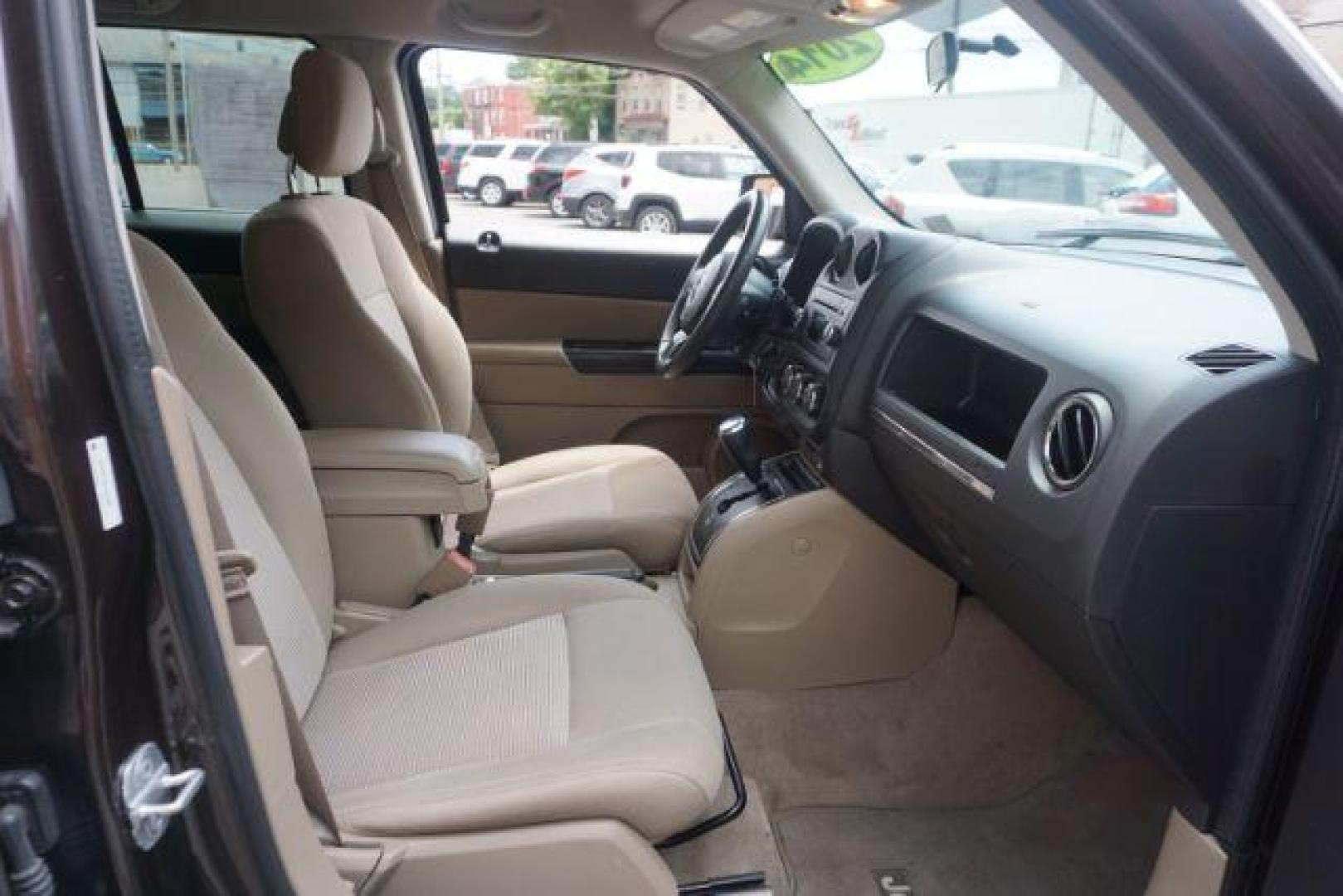 2014 Rugged Brown Pearlcoat /Light Pebble Beige/Dk Slate Jeep Patriot Latitude 4WD (1C4NJRFB3ED) with an 2.4L L4 DOHC 16V engine, Continuously Variable Transmission transmission, located at 312 Centre Ave, Schuylkill Haven, PA, 17972, (570) 593-5278, 40.638130, -76.177383 - Boston Accoustics stereo, locking/limited slip differential, power sunroof - Photo#47