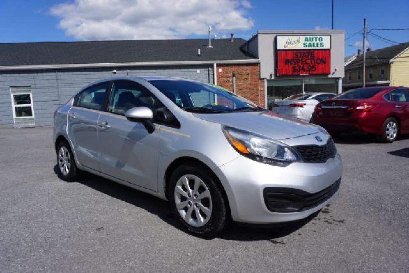 2014 Bright Silver /Black Kia Rio LX (KNADM4A36E6) with an 1.6L L4 DOHC 16V engine, located at 312 Centre Ave, Schuylkill Haven, PA, 17972, (570) 593-5278, 40.638130, -76.177383 - aluminum/alloy wheels - Photo#0