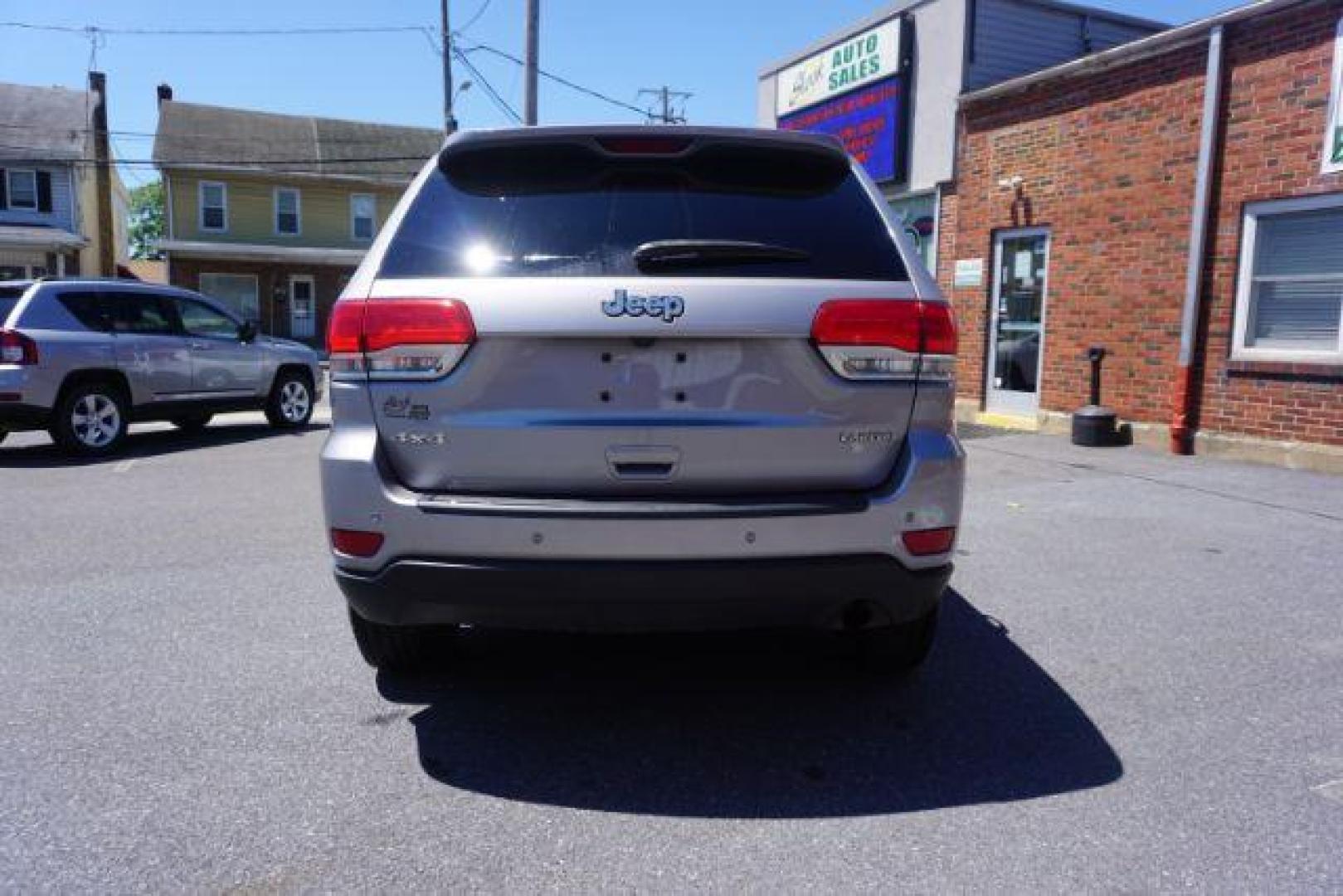 2016 Billet Silver Metallic Clear Coat Jeep Grand Cherokee SPORT UTILITY 4-DR (1C4RJFAG5GC) with an 3.6L V6 DOHC 24V engine, 8-Speed Automatic transmission, located at 312 Centre Ave, Schuylkill Haven, PA, 17972, (570) 593-5278, 40.638130, -76.177383 - navigation system, power liftgate, rear parking sensors, universal garage door opener - Photo#12