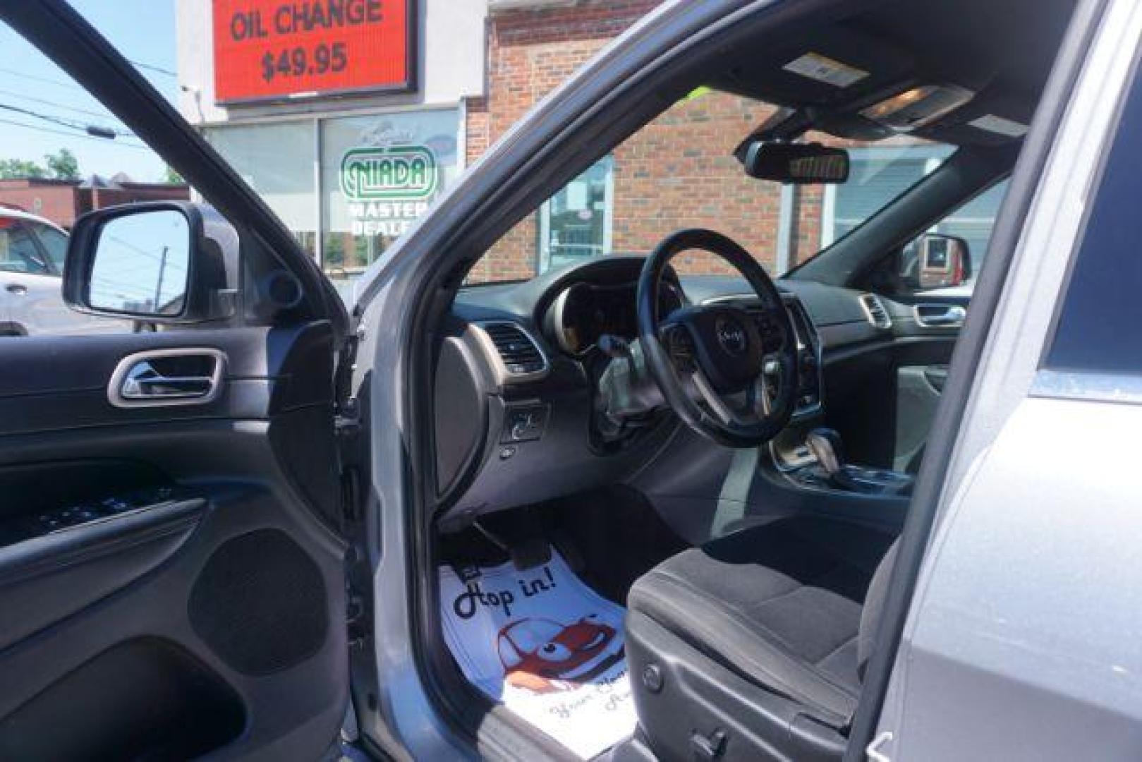 2016 Billet Silver Metallic Clear Coat Jeep Grand Cherokee SPORT UTILITY 4-DR (1C4RJFAG5GC) with an 3.6L V6 DOHC 24V engine, 8-Speed Automatic transmission, located at 312 Centre Ave, Schuylkill Haven, PA, 17972, (570) 593-5278, 40.638130, -76.177383 - navigation system, power liftgate, rear parking sensors, universal garage door opener - Photo#17