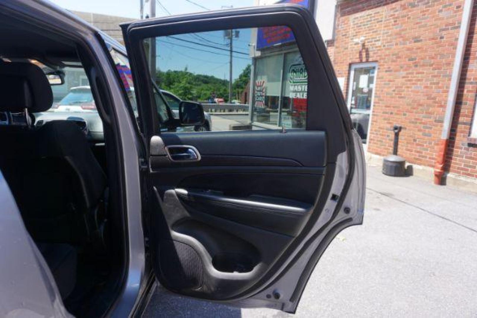 2016 Billet Silver Metallic Clear Coat Jeep Grand Cherokee SPORT UTILITY 4-DR (1C4RJFAG5GC) with an 3.6L V6 DOHC 24V engine, 8-Speed Automatic transmission, located at 312 Centre Ave, Schuylkill Haven, PA, 17972, (570) 593-5278, 40.638130, -76.177383 - navigation system, power liftgate, rear parking sensors, universal garage door opener - Photo#40