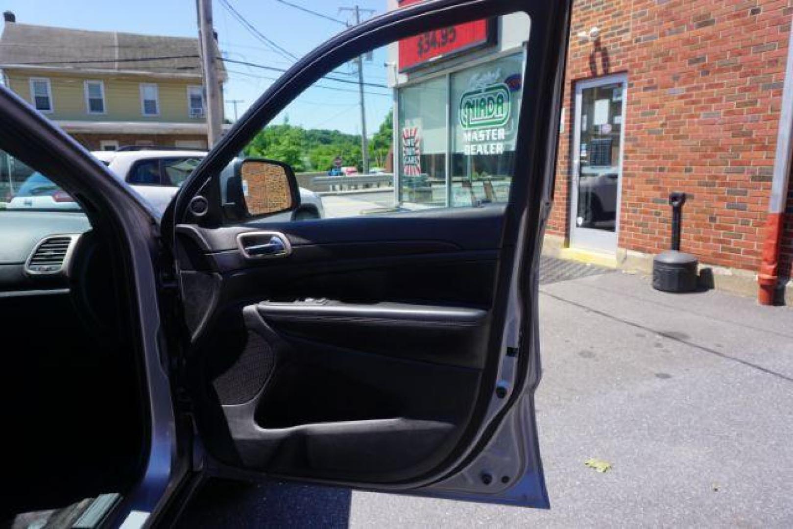 2016 Billet Silver Metallic Clear Coat Jeep Grand Cherokee SPORT UTILITY 4-DR (1C4RJFAG5GC) with an 3.6L V6 DOHC 24V engine, 8-Speed Automatic transmission, located at 312 Centre Ave, Schuylkill Haven, PA, 17972, (570) 593-5278, 40.638130, -76.177383 - navigation system, power liftgate, rear parking sensors, universal garage door opener - Photo#47