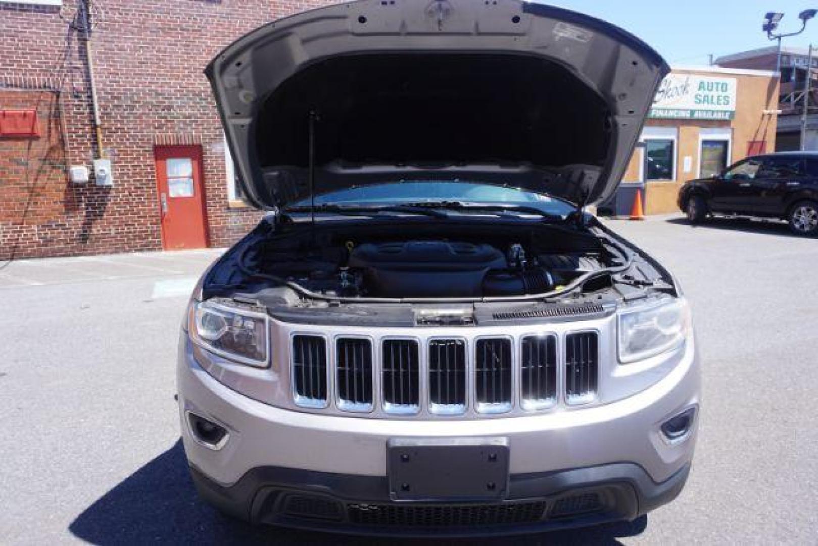 2016 Billet Silver Metallic Clear Coat Jeep Grand Cherokee SPORT UTILITY 4-DR (1C4RJFAG5GC) with an 3.6L V6 DOHC 24V engine, 8-Speed Automatic transmission, located at 312 Centre Ave, Schuylkill Haven, PA, 17972, (570) 593-5278, 40.638130, -76.177383 - navigation system, power liftgate, rear parking sensors, universal garage door opener - Photo#53