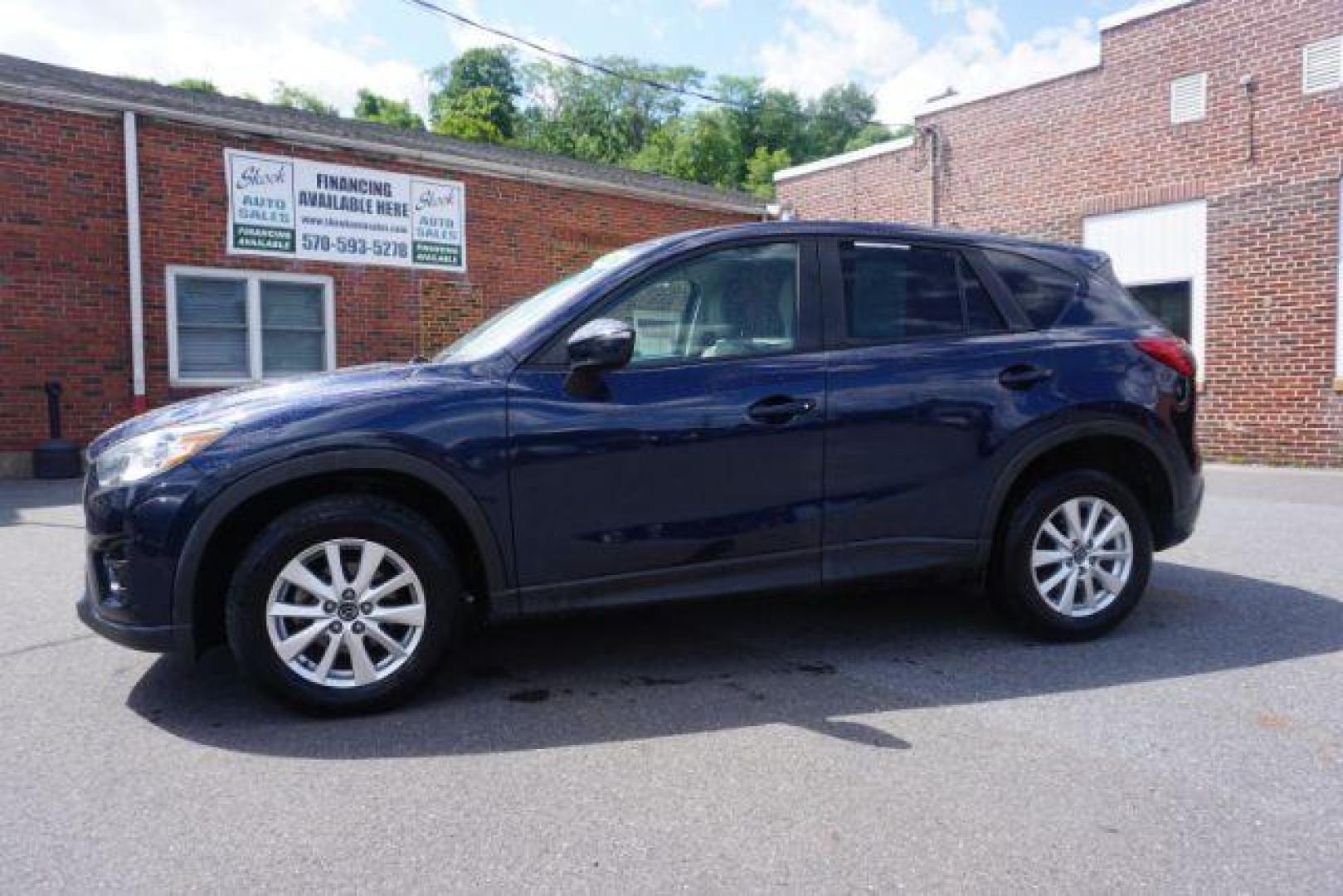 2016 Blue /sand Mazda CX-5 Touring AWD (JM3KE4CY8G0) with an 2.5L L4 DOHC 16V engine, 6-Speed Automatic transmission, located at 312 Centre Ave, Schuylkill Haven, PA, 17972, (570) 593-5278, 40.638130, -76.177383 - rear parking sensors - Photo#0