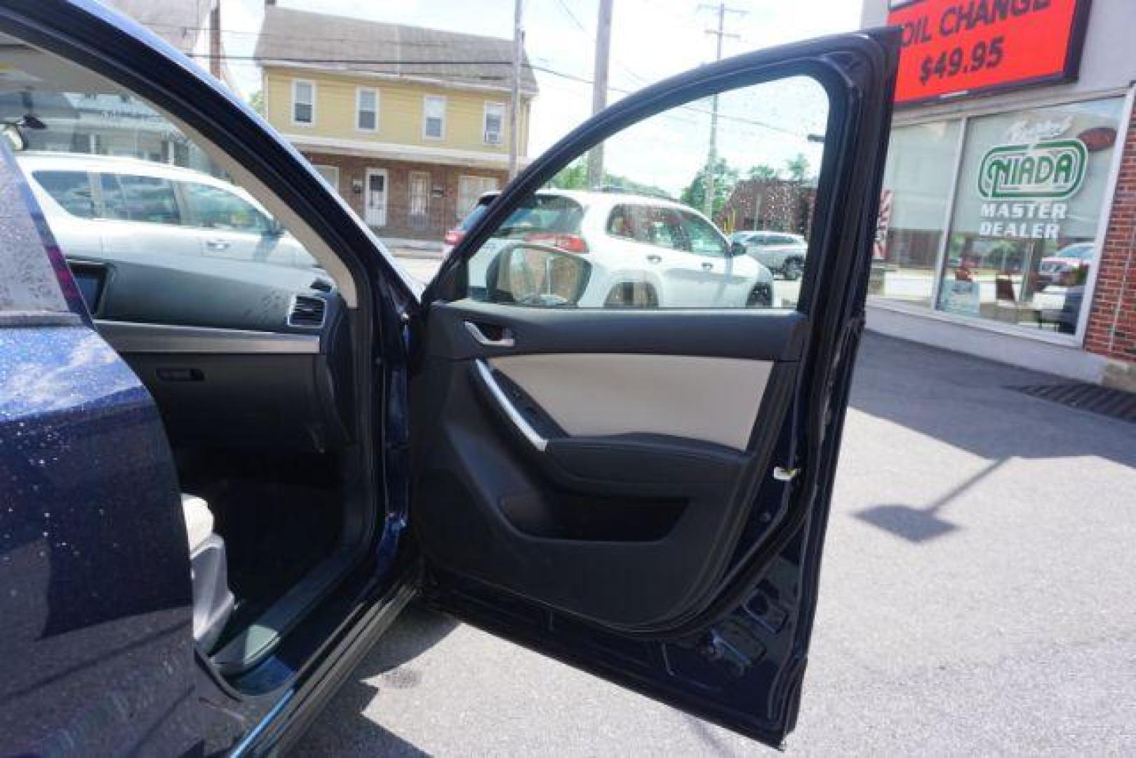 2016 Blue /sand Mazda CX-5 Touring AWD (JM3KE4CY8G0) with an 2.5L L4 DOHC 16V engine, 6-Speed Automatic transmission, located at 312 Centre Ave, Schuylkill Haven, PA, 17972, (570) 593-5278, 40.638130, -76.177383 - rear parking sensors - Photo#5