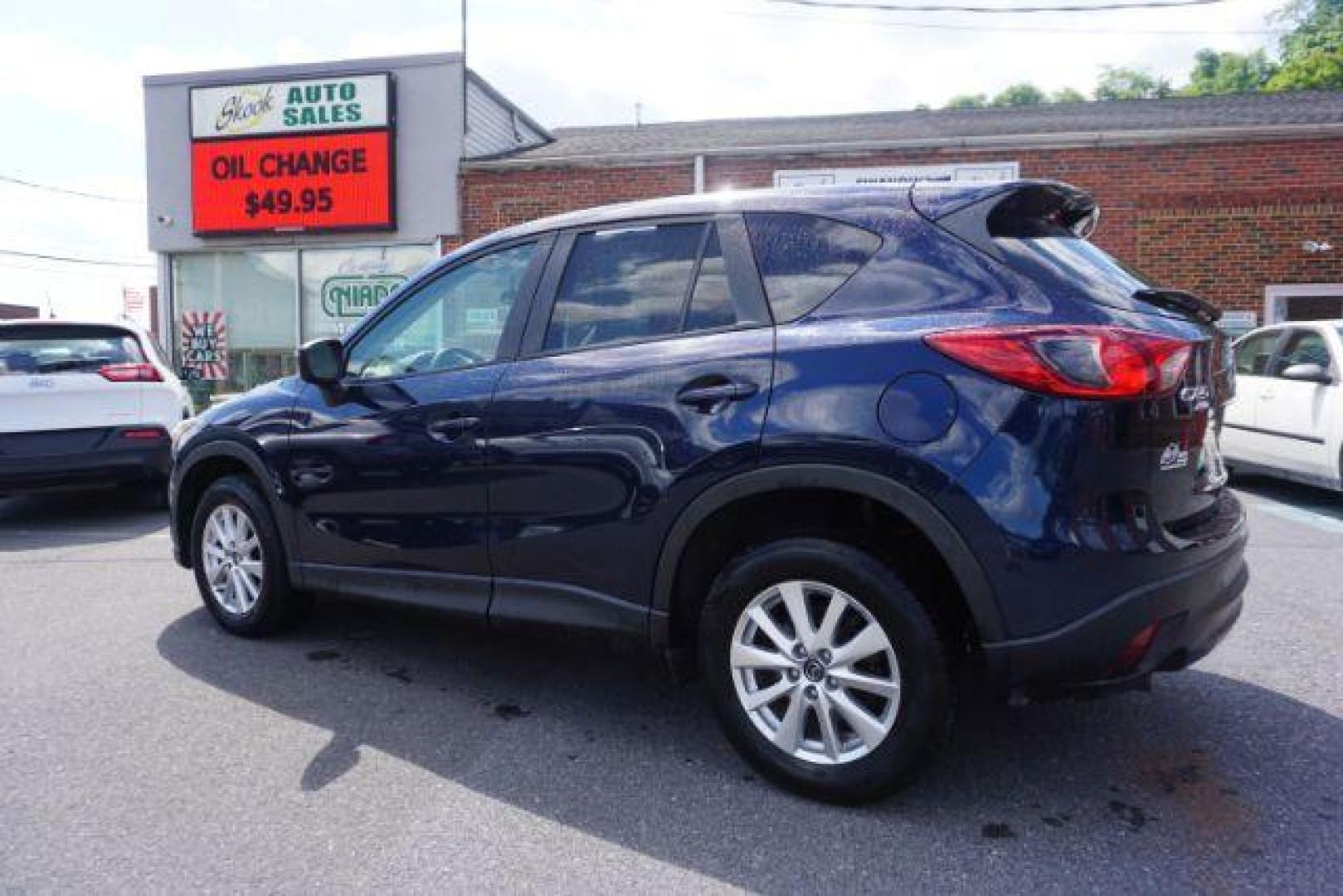 2016 Blue /sand Mazda CX-5 Touring AWD (JM3KE4CY8G0) with an 2.5L L4 DOHC 16V engine, 6-Speed Automatic transmission, located at 312 Centre Ave, Schuylkill Haven, PA, 17972, (570) 593-5278, 40.638130, -76.177383 - rear parking sensors - Photo#4