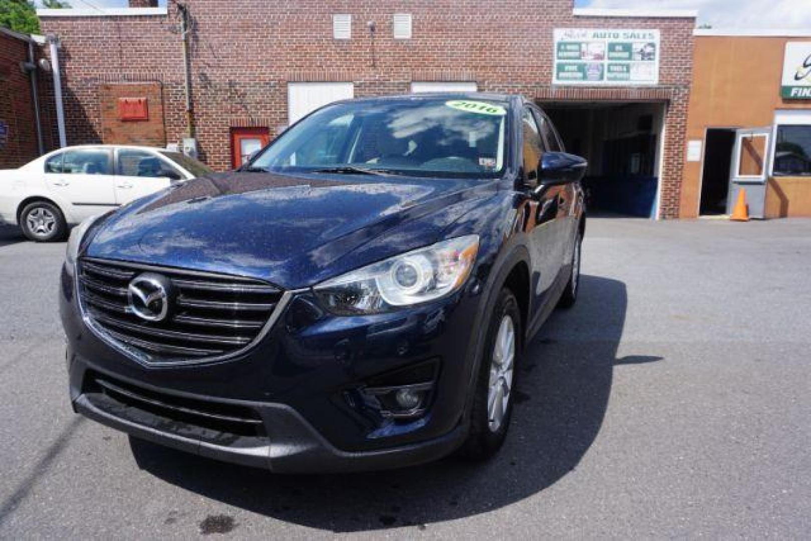 2016 Blue /sand Mazda CX-5 Touring AWD (JM3KE4CY8G0) with an 2.5L L4 DOHC 16V engine, 6-Speed Automatic transmission, located at 312 Centre Ave, Schuylkill Haven, PA, 17972, (570) 593-5278, 40.638130, -76.177383 - rear parking sensors - Photo#14