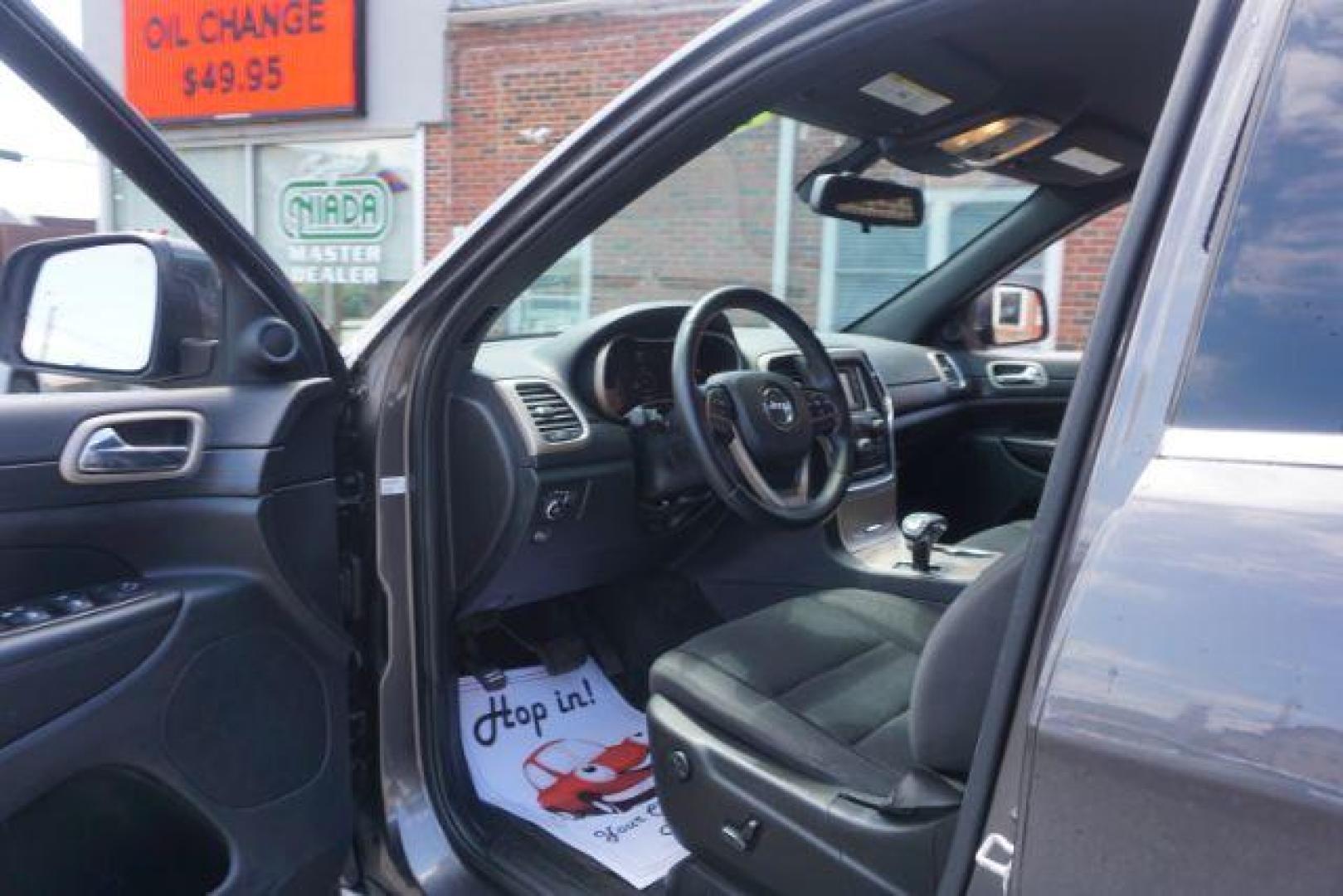 2015 Granite Crystal Met CC /Black Jeep Grand Cherokee Laredo 4WD (1C4RJFAG4FC) with an 3.6L V6 DOHC 24V engine, 8-Speed Automatic transmission, located at 312 Centre Ave, Schuylkill Haven, PA, 17972, (570) 593-5278, 40.638130, -76.177383 - heated front seats, universal garage door opener - Photo#20