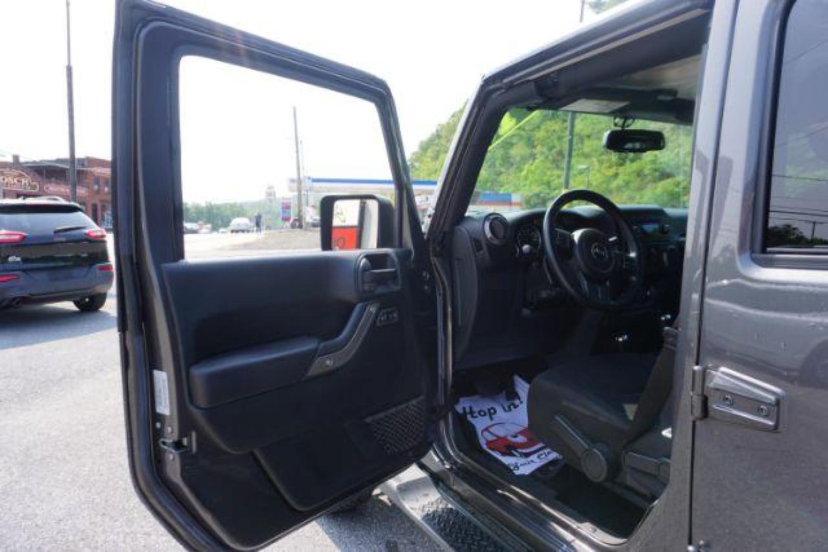 2016 Granite Crystal Metallic Clear Coat /Black, cloth Jeep Wrangler Unlimited Sport 4WD (1C4BJWDG5GL) with an 3.6L V6 DOHC 24V FFV engine, located at 312 Centre Ave, Schuylkill Haven, PA, 17972, (570) 593-5278, 40.638130, -76.177383 - Hard Top, Locking limited slip differential, Bluetooth connection - Photo#14