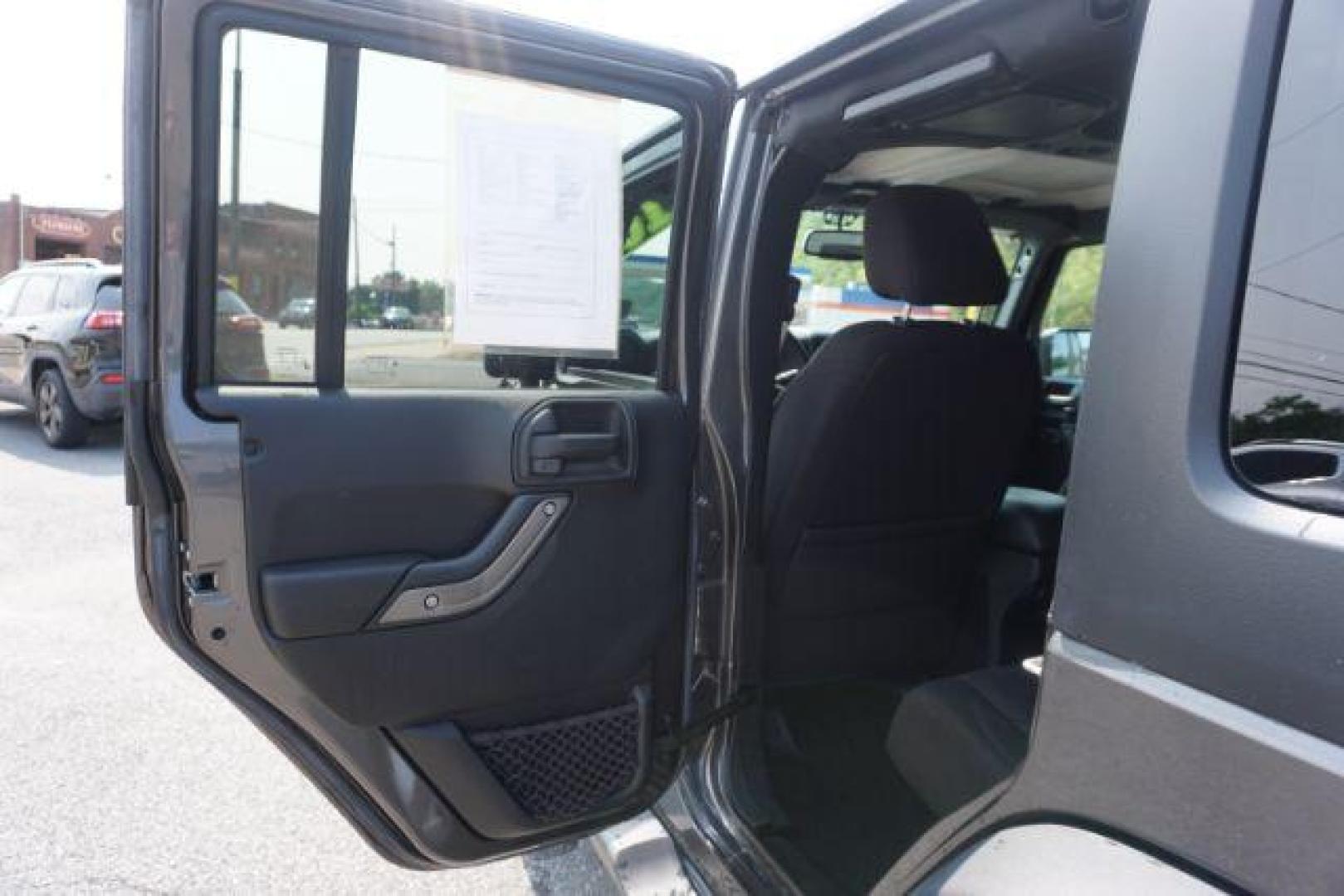 2016 Granite Crystal Metallic Clear Coat /Black, cloth Jeep Wrangler Unlimited Sport 4WD (1C4BJWDG5GL) with an 3.6L V6 DOHC 24V FFV engine, located at 312 Centre Ave, Schuylkill Haven, PA, 17972, (570) 593-5278, 40.638130, -76.177383 - Hard Top, Locking limited slip differential, Bluetooth connection - Photo#26