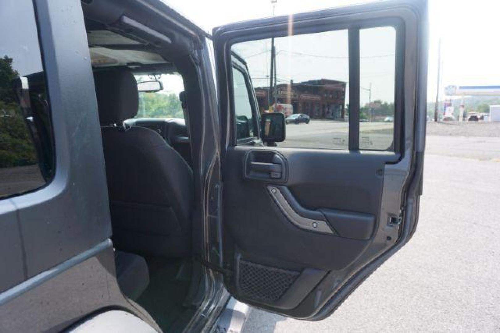 2016 Granite Crystal Metallic Clear Coat /Black, cloth Jeep Wrangler Unlimited Sport 4WD (1C4BJWDG5GL) with an 3.6L V6 DOHC 24V FFV engine, located at 312 Centre Ave, Schuylkill Haven, PA, 17972, (570) 593-5278, 40.638130, -76.177383 - Hard Top, Locking limited slip differential, Bluetooth connection - Photo#40