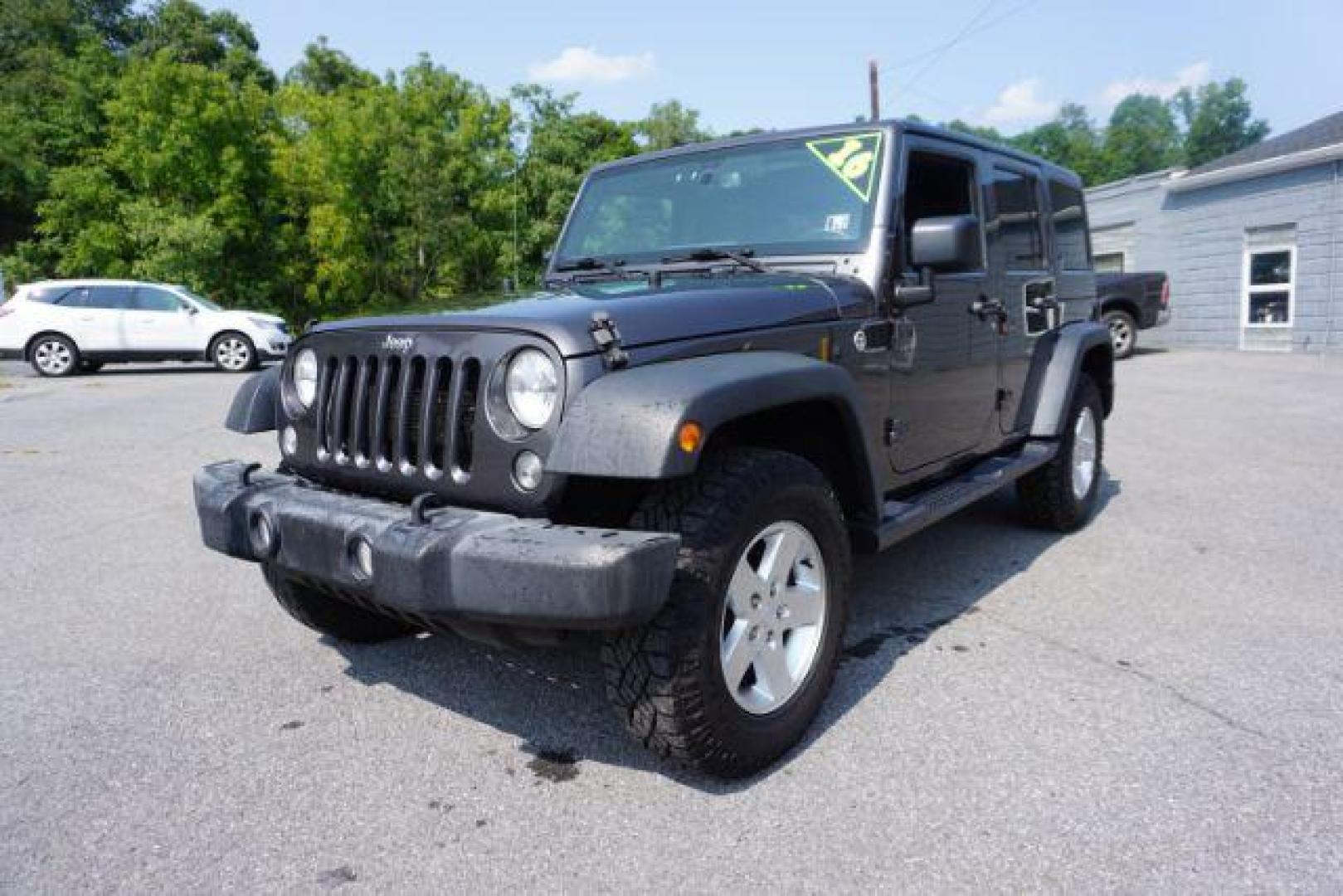 2016 Granite Crystal Metallic Clear Coat /Black, cloth Jeep Wrangler Unlimited Sport 4WD (1C4BJWDG5GL) with an 3.6L V6 DOHC 24V FFV engine, located at 312 Centre Ave, Schuylkill Haven, PA, 17972, (570) 593-5278, 40.638130, -76.177383 - Hard Top, Locking limited slip differential, Bluetooth connection - Photo#4