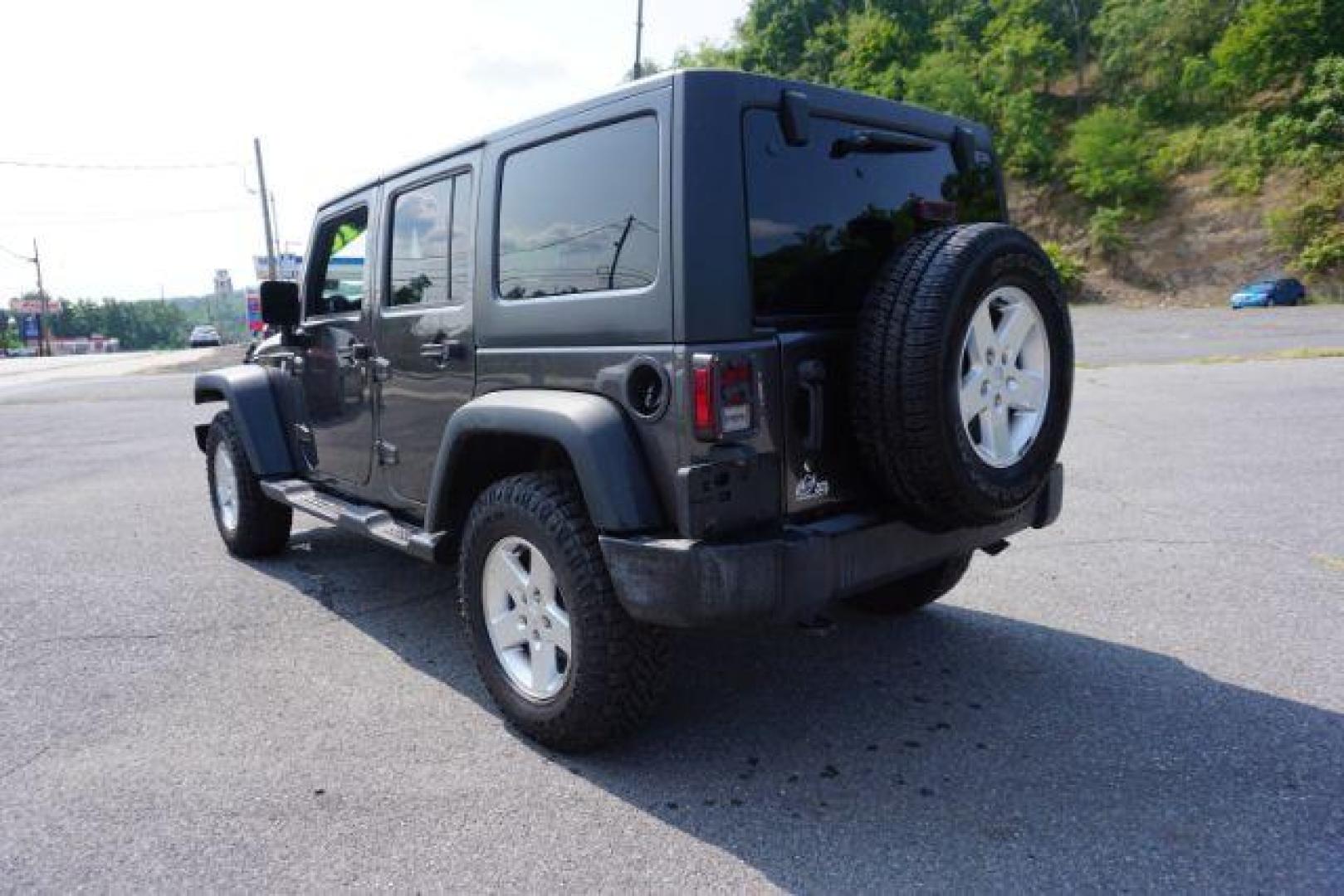 2016 Granite Crystal Metallic Clear Coat /Black, cloth Jeep Wrangler Unlimited Sport 4WD (1C4BJWDG5GL) with an 3.6L V6 DOHC 24V FFV engine, located at 312 Centre Ave, Schuylkill Haven, PA, 17972, (570) 593-5278, 40.638130, -76.177383 - Hard Top, Locking limited slip differential, Bluetooth connection - Photo#8