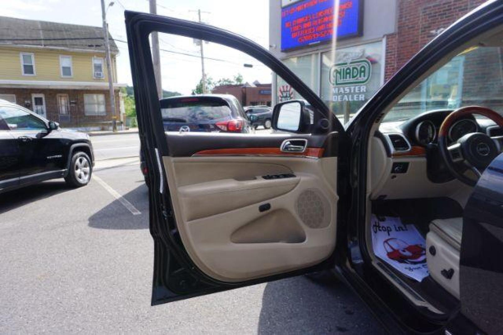 2013 Brilliant Black Crystal Pearl Jeep Grand Cherokee Overland 4WD (1C4RJFCG7DC) with an 3.6L V6 DOHC 24V engine, 5-Speed Automatic transmission, located at 312 Centre Ave, Schuylkill Haven, PA, 17972, (570) 593-5278, 40.638130, -76.177383 - blind spot monitor, collision avoidance system, rear parking sensors, towing pkg - Photo#18