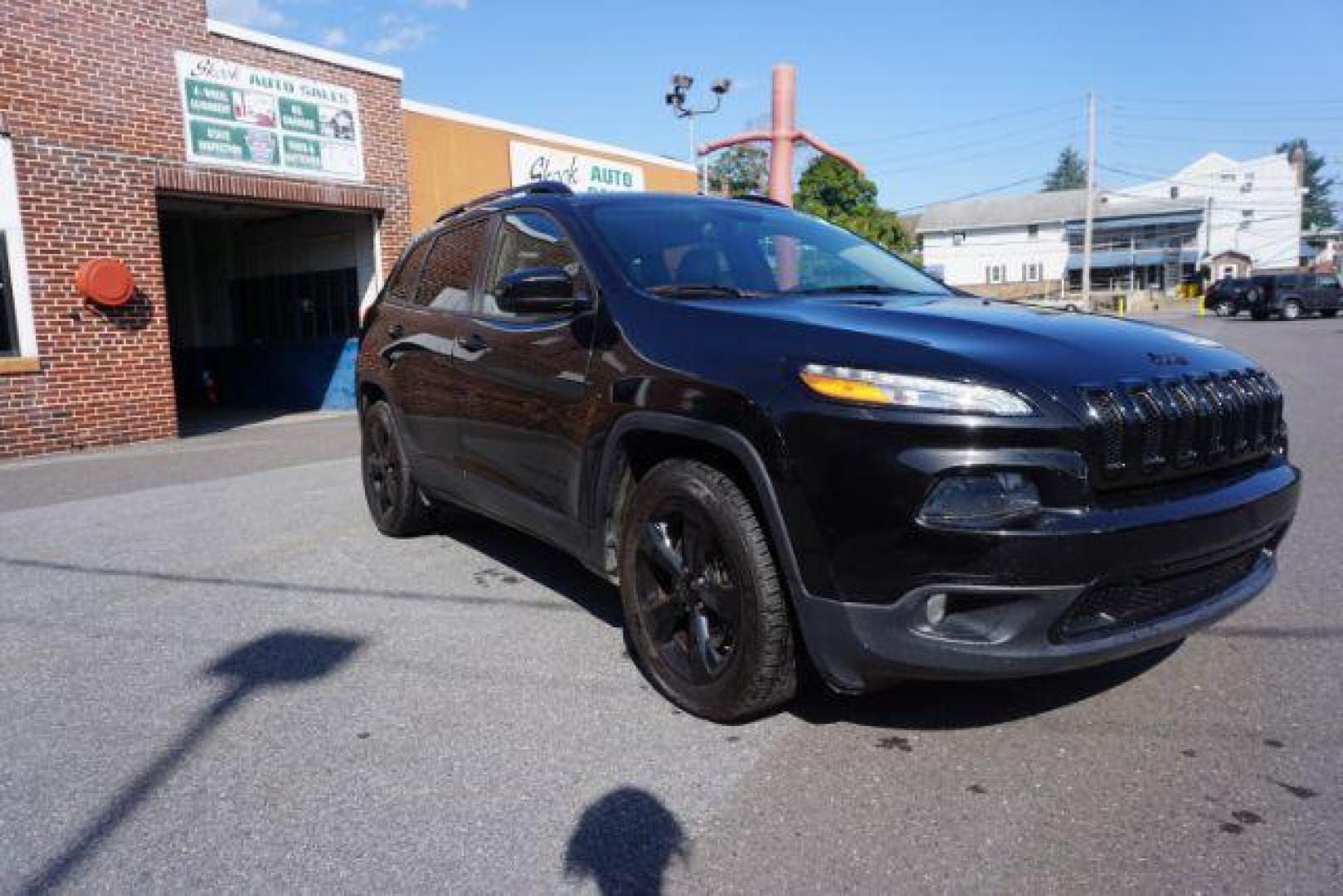 2016 Brilliant Black Crystal Pearl Coat Jeep Cherokee Limited 4WD (1C4PJMDS0GW) with an 3.2L V6 DOHC 24V engine, 9-Speed Automatic transmission, located at 312 Centre Ave, Schuylkill Haven, PA, 17972, (570) 593-5278, 40.638130, -76.177383 - adaptive cruise control, driver's seat memory, HID headlamps, heated exterior mirrors, heated front seats, leather seats, luggage rack, navigation system, passive keyless entry, power driver's seat, power liftgate, power sunroof, rear parking sensors, remote engine starter - Photo#9