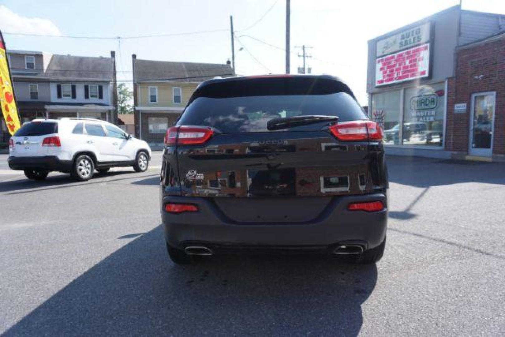 2016 Brilliant Black Crystal Pearl Coat Jeep Cherokee Limited 4WD (1C4PJMDS0GW) with an 3.2L V6 DOHC 24V engine, 9-Speed Automatic transmission, located at 312 Centre Ave, Schuylkill Haven, PA, 17972, (570) 593-5278, 40.638130, -76.177383 - adaptive cruise control, driver's seat memory, HID headlamps, heated exterior mirrors, heated front seats, leather seats, luggage rack, navigation system, passive keyless entry, power driver's seat, power liftgate, power sunroof, rear parking sensors, remote engine starter - Photo#16