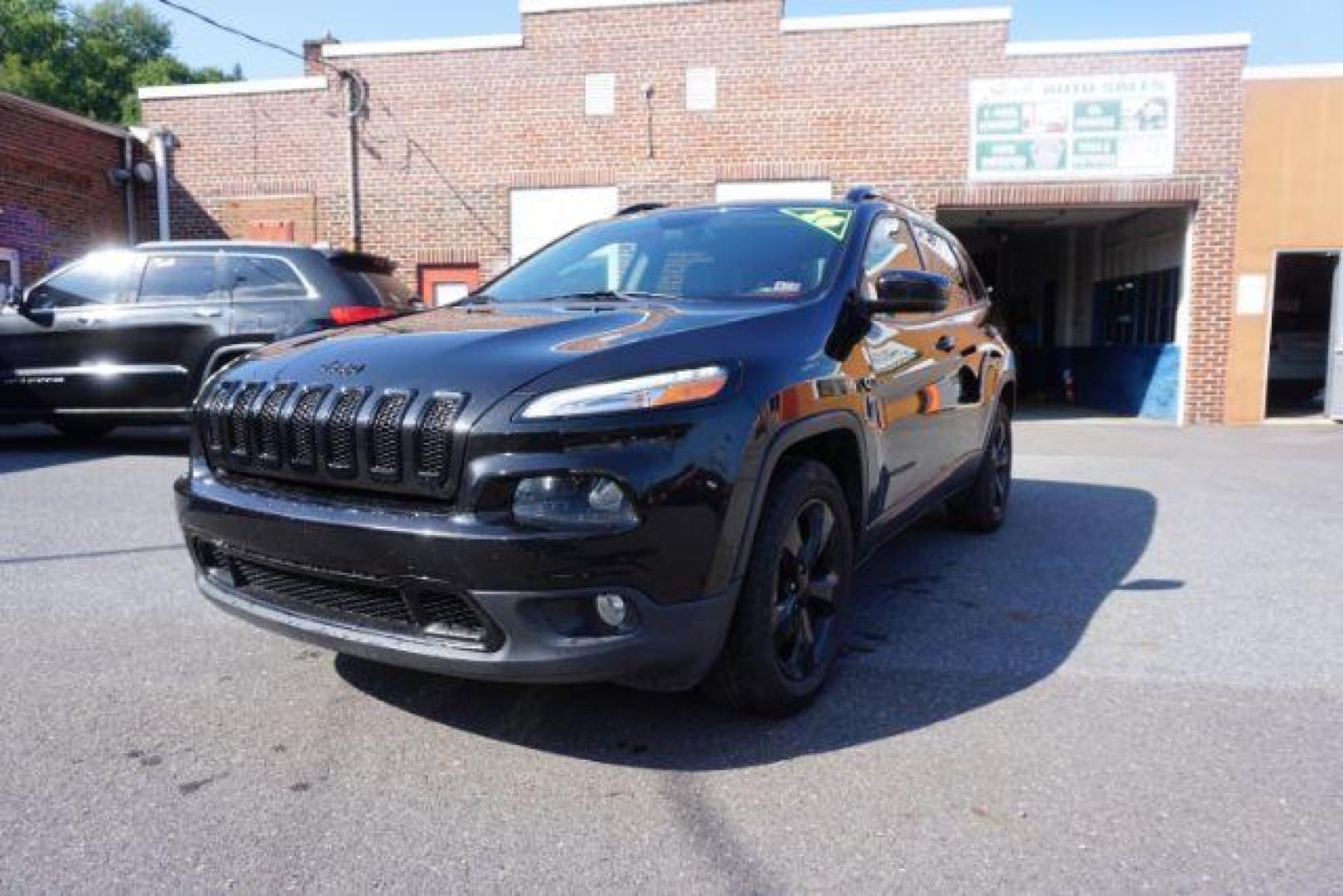 2016 Brilliant Black Crystal Pearl Coat Jeep Cherokee Limited 4WD (1C4PJMDS0GW) with an 3.2L V6 DOHC 24V engine, 9-Speed Automatic transmission, located at 312 Centre Ave, Schuylkill Haven, PA, 17972, (570) 593-5278, 40.638130, -76.177383 - adaptive cruise control, driver's seat memory, HID headlamps, heated exterior mirrors, heated front seats, leather seats, luggage rack, navigation system, passive keyless entry, power driver's seat, power liftgate, power sunroof, rear parking sensors, remote engine starter - Photo#4