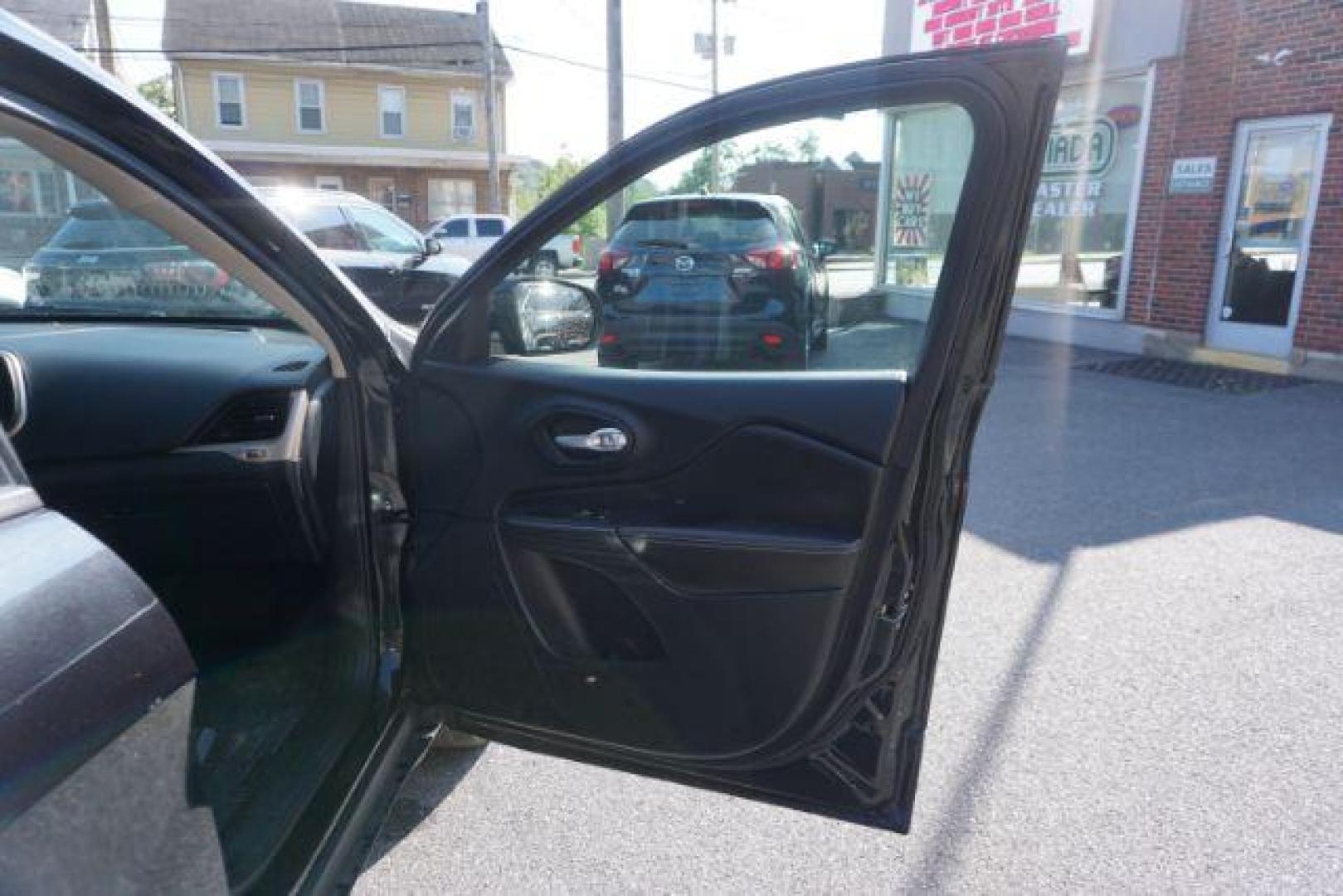 2016 Brilliant Black Crystal Pearl Coat Jeep Cherokee Limited 4WD (1C4PJMDS0GW) with an 3.2L V6 DOHC 24V engine, 9-Speed Automatic transmission, located at 312 Centre Ave, Schuylkill Haven, PA, 17972, (570) 593-5278, 40.638130, -76.177383 - adaptive cruise control, driver's seat memory, HID headlamps, heated exterior mirrors, heated front seats, leather seats, luggage rack, navigation system, passive keyless entry, power driver's seat, power liftgate, power sunroof, rear parking sensors, remote engine starter - Photo#57