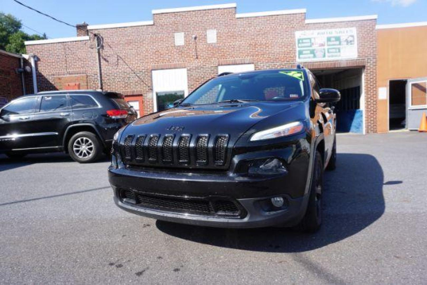 2016 Brilliant Black Crystal Pearl Coat Jeep Cherokee Limited 4WD (1C4PJMDS0GW) with an 3.2L V6 DOHC 24V engine, 9-Speed Automatic transmission, located at 312 Centre Ave, Schuylkill Haven, PA, 17972, (570) 593-5278, 40.638130, -76.177383 - adaptive cruise control, driver's seat memory, HID headlamps, heated exterior mirrors, heated front seats, leather seats, luggage rack, navigation system, passive keyless entry, power driver's seat, power liftgate, power sunroof, rear parking sensors, remote engine starter - Photo#5