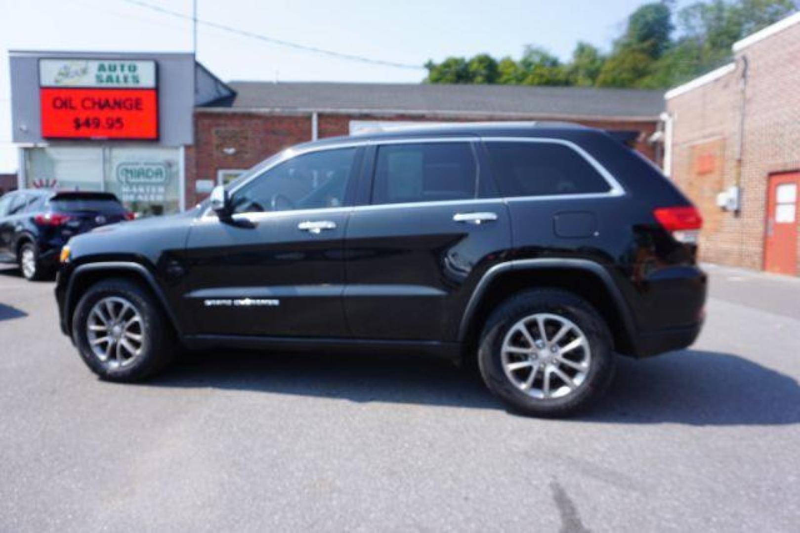 2015 Brilliant Black Crystal P /Black Jeep Grand Cherokee Limited 4WD (1C4RJFBG6FC) with an 3.6L V6 DOHC 24V engine, 8-Speed Automatic transmission, located at 312 Centre Ave, Schuylkill Haven, PA, 17972, (570) 593-5278, 40.638130, -76.177383 - adaptive cruise control, advanced technology pkg, back up camera, blind spot monitor, collision avoidance system, cooled front seats, HID headlamps, heated front seats, leather seats, navigation system, power liftgate, power sunroof, rear parking sensors, towing pkg, universal garage door opener - Photo#4