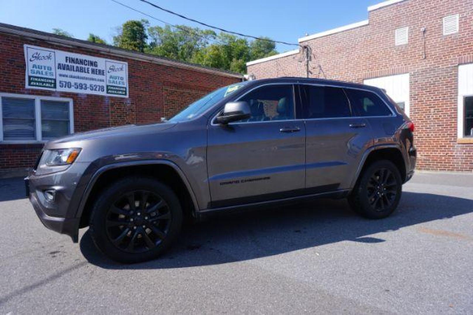 2015 Granite Crystal Met CC /Black Jeep Grand Cherokee Laredo 4WD (1C4RJFAG1FC) with an 3.6L V6 DOHC 24V engine, 8-Speed Automatic transmission, located at 312 Centre Ave, Schuylkill Haven, PA, 17972, (570) 593-5278, 40.638130, -76.177383 - leather seats, back up camera, heated front seats, power liftgate, rear parking sensors - Photo#0