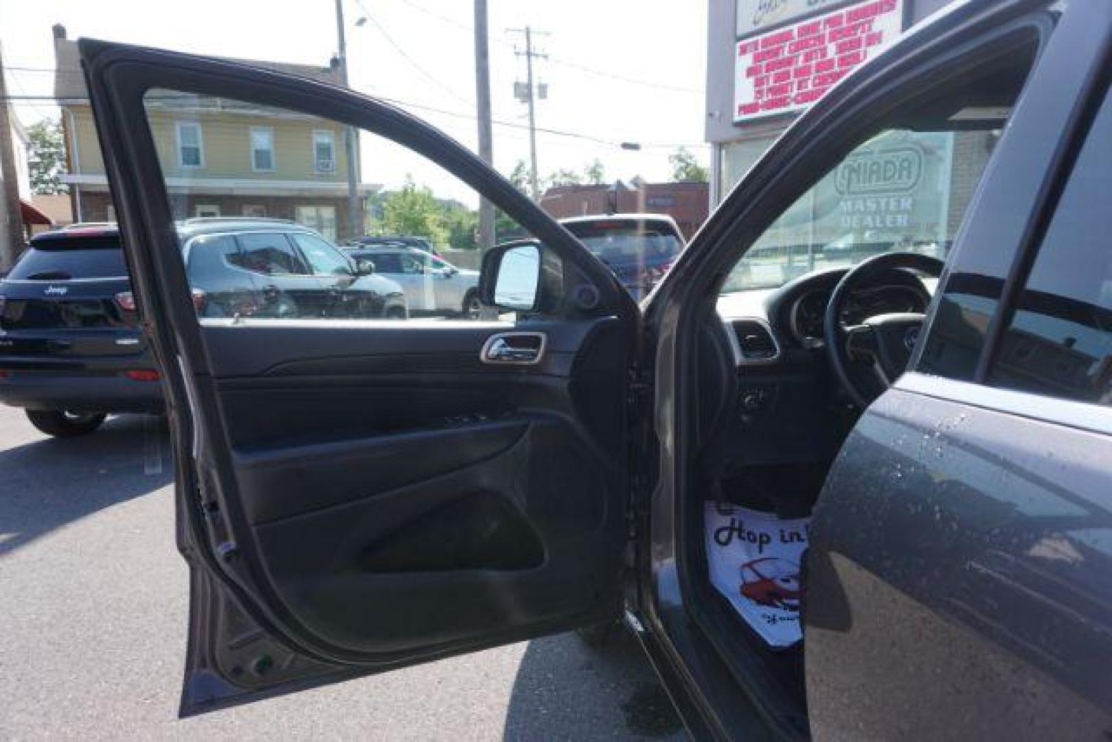 2015 Granite Crystal Met CC /Black Jeep Grand Cherokee Laredo 4WD (1C4RJFAG1FC) with an 3.6L V6 DOHC 24V engine, 8-Speed Automatic transmission, located at 312 Centre Ave, Schuylkill Haven, PA, 17972, (570) 593-5278, 40.638130, -76.177383 - leather seats, back up camera, heated front seats, power liftgate, rear parking sensors - Photo#17