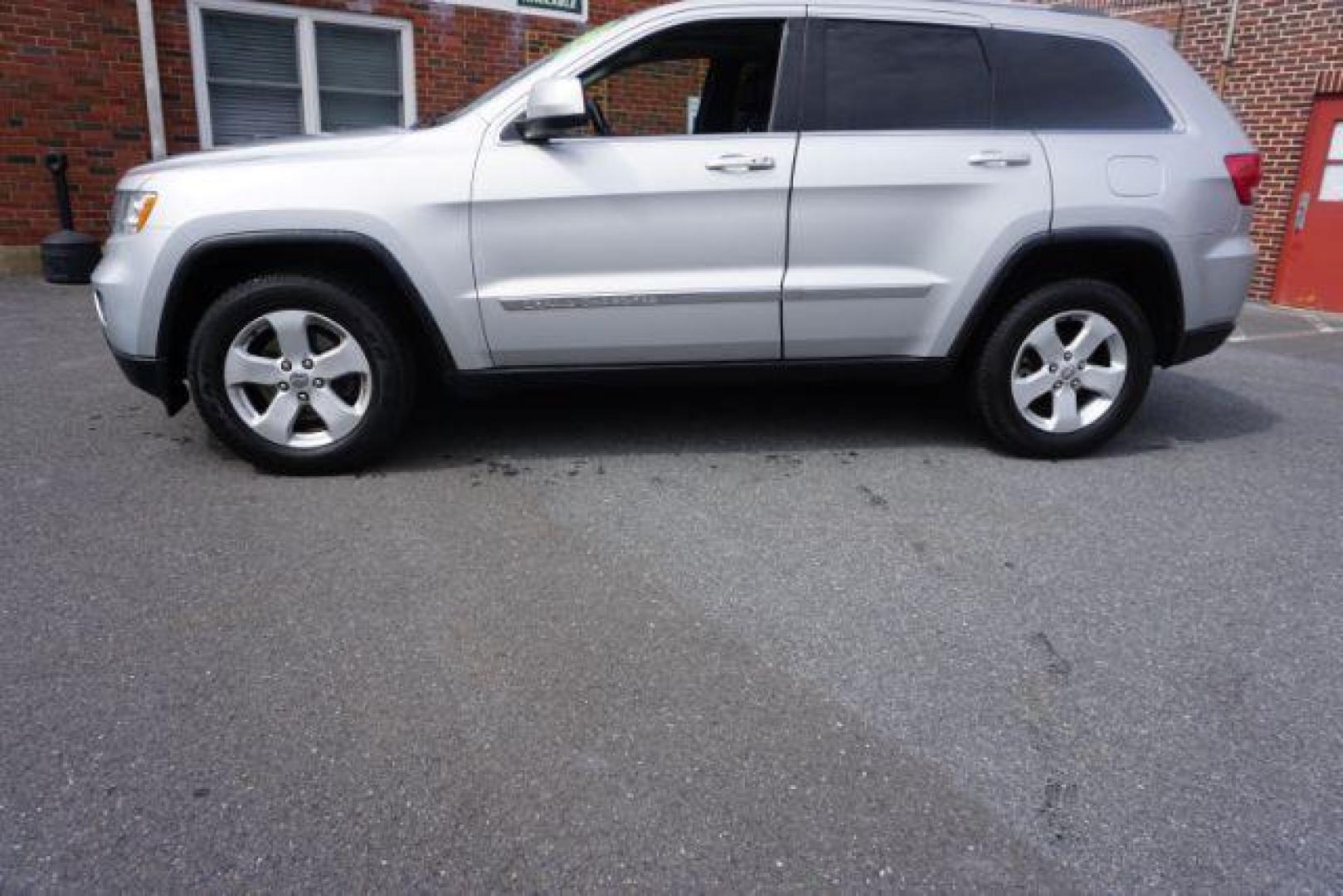 2012 Bright Silver Metallic /Black Leather Interior Jeep Grand Cherokee Laredo 4WD (1C4RJFAG2CC) with an 3.6L V6 DOHC 24V engine, 5-Speed Automatic transmission, located at 312 Centre Ave, Schuylkill Haven, PA, 17972, (570) 593-5278, 40.638130, -76.177383 - automatic climate control, back up camera, heated front seats, leather seats, navigation, power liftgate, rear parking sensors - Photo#0