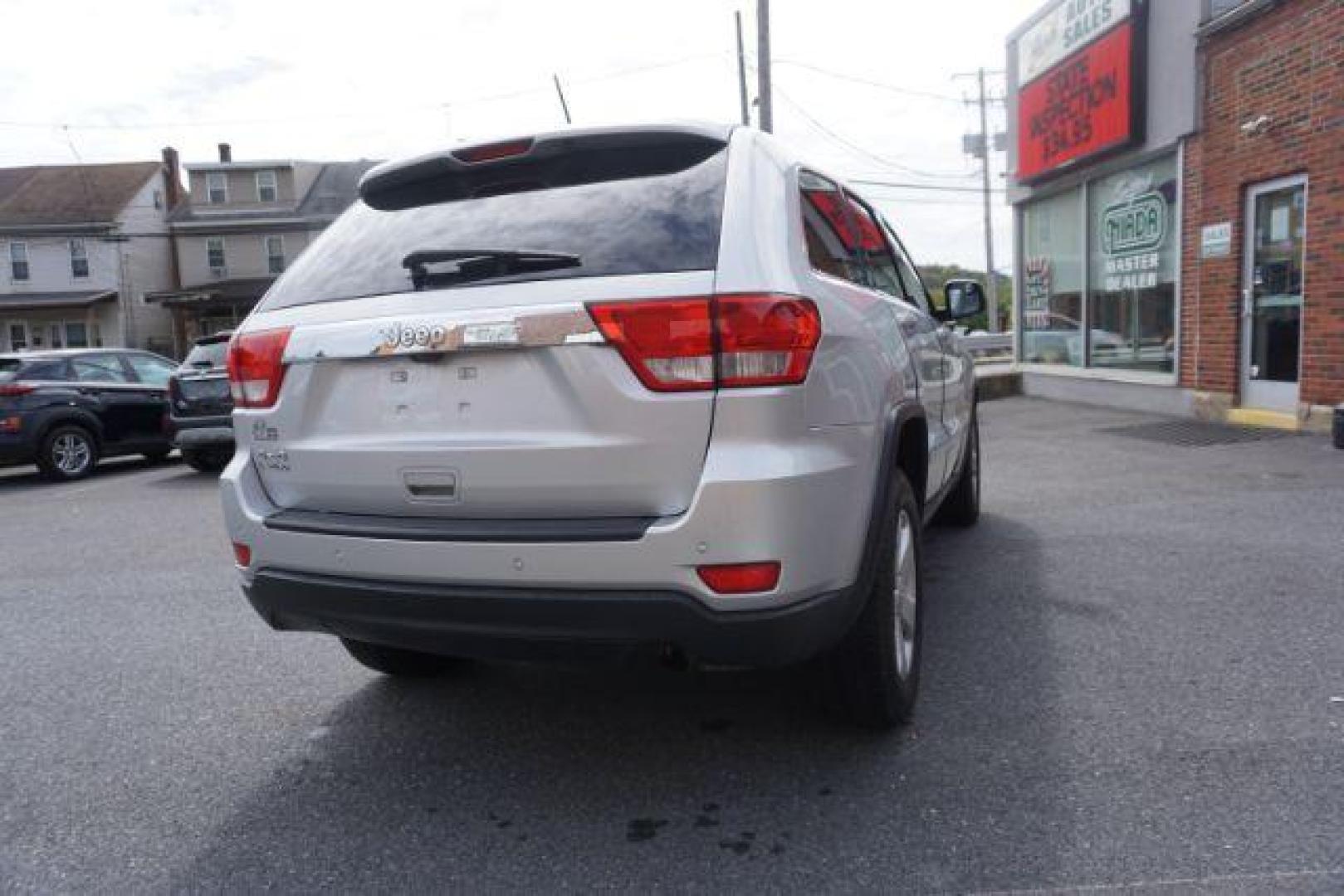 2012 Bright Silver Metallic /Black Leather Interior Jeep Grand Cherokee Laredo 4WD (1C4RJFAG2CC) with an 3.6L V6 DOHC 24V engine, 5-Speed Automatic transmission, located at 312 Centre Ave, Schuylkill Haven, PA, 17972, (570) 593-5278, 40.638130, -76.177383 - automatic climate control, back up camera, heated front seats, leather seats, navigation, power liftgate, rear parking sensors - Photo#13