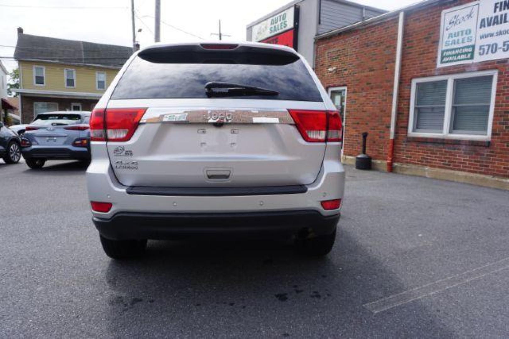 2012 Bright Silver Metallic /Black Leather Interior Jeep Grand Cherokee Laredo 4WD (1C4RJFAG2CC) with an 3.6L V6 DOHC 24V engine, 5-Speed Automatic transmission, located at 312 Centre Ave, Schuylkill Haven, PA, 17972, (570) 593-5278, 40.638130, -76.177383 - automatic climate control, back up camera, heated front seats, leather seats, navigation, power liftgate, rear parking sensors - Photo#14