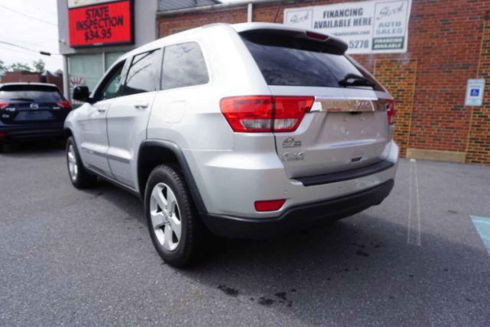 2012 Bright Silver Metallic /Black Leather Interior Jeep Grand Cherokee Laredo 4WD (1C4RJFAG2CC) with an 3.6L V6 DOHC 24V engine, 5-Speed Automatic transmission, located at 312 Centre Ave, Schuylkill Haven, PA, 17972, (570) 593-5278, 40.638130, -76.177383 - automatic climate control, back up camera, heated front seats, leather seats, navigation, power liftgate, rear parking sensors - Photo#16