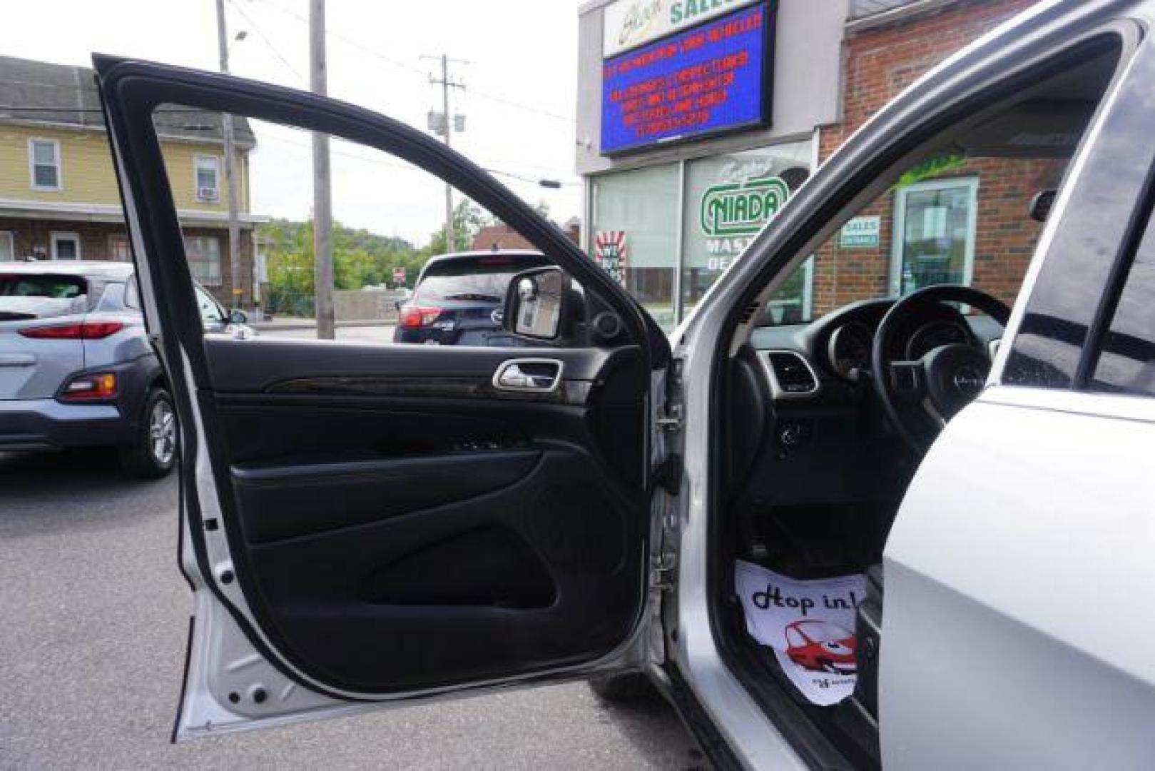 2012 Bright Silver Metallic /Black Leather Interior Jeep Grand Cherokee Laredo 4WD (1C4RJFAG2CC) with an 3.6L V6 DOHC 24V engine, 5-Speed Automatic transmission, located at 312 Centre Ave, Schuylkill Haven, PA, 17972, (570) 593-5278, 40.638130, -76.177383 - automatic climate control, back up camera, heated front seats, leather seats, navigation, power liftgate, rear parking sensors - Photo#18