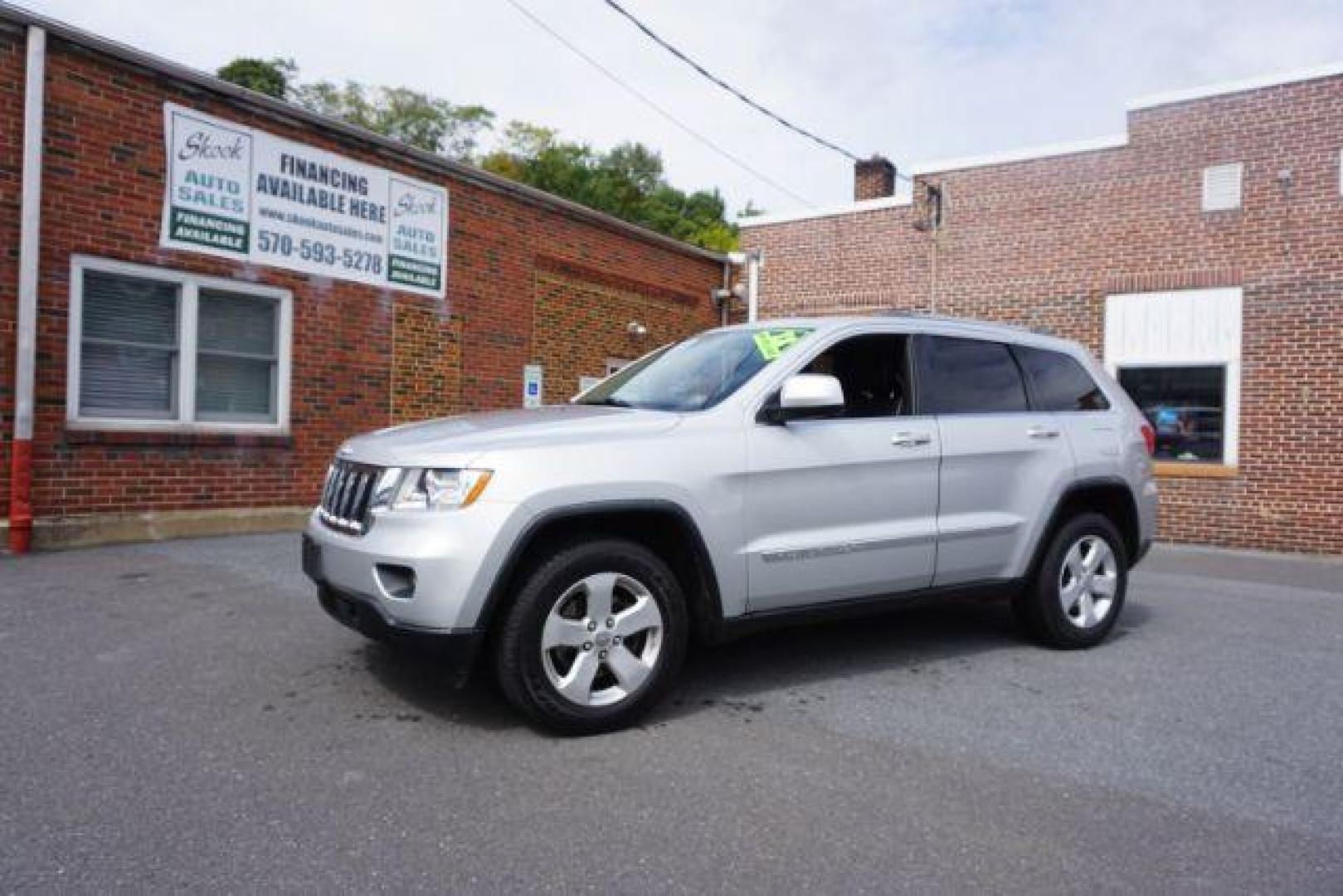 2012 Bright Silver Metallic /Black Leather Interior Jeep Grand Cherokee Laredo 4WD (1C4RJFAG2CC) with an 3.6L V6 DOHC 24V engine, 5-Speed Automatic transmission, located at 312 Centre Ave, Schuylkill Haven, PA, 17972, (570) 593-5278, 40.638130, -76.177383 - automatic climate control, back up camera, heated front seats, leather seats, navigation, power liftgate, rear parking sensors - Photo#2