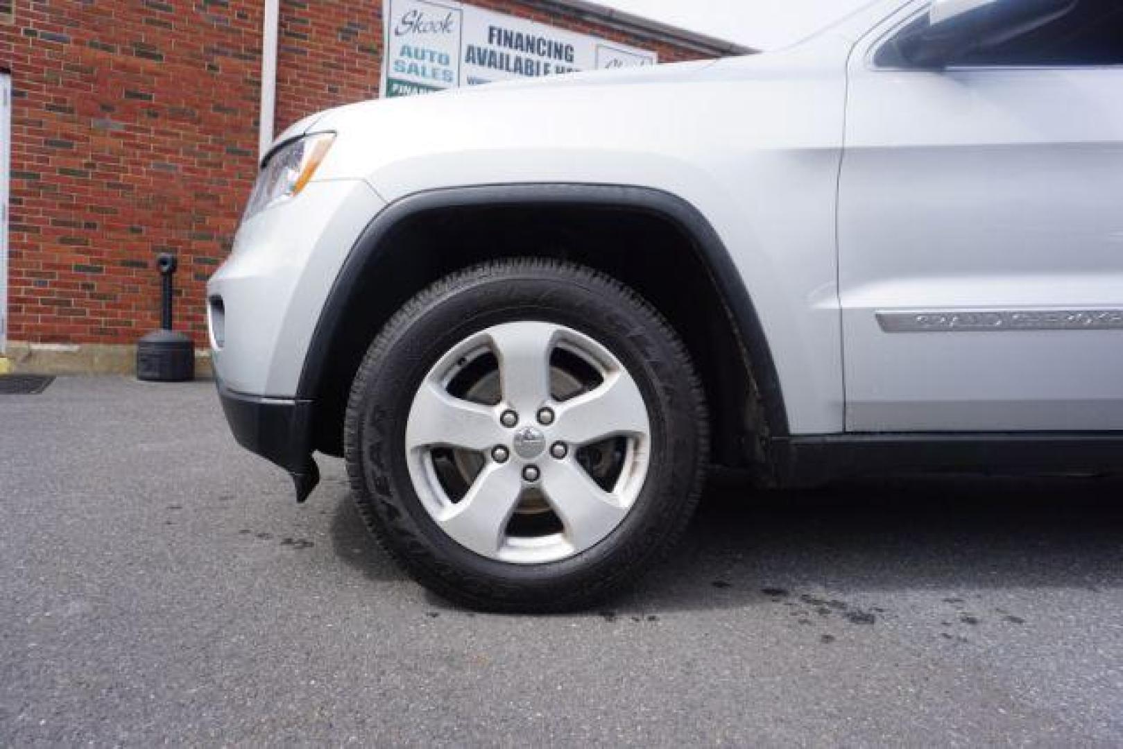 2012 Bright Silver Metallic /Black Leather Interior Jeep Grand Cherokee Laredo 4WD (1C4RJFAG2CC) with an 3.6L V6 DOHC 24V engine, 5-Speed Automatic transmission, located at 312 Centre Ave, Schuylkill Haven, PA, 17972, (570) 593-5278, 40.638130, -76.177383 - automatic climate control, back up camera, heated front seats, leather seats, navigation, power liftgate, rear parking sensors - Photo#3