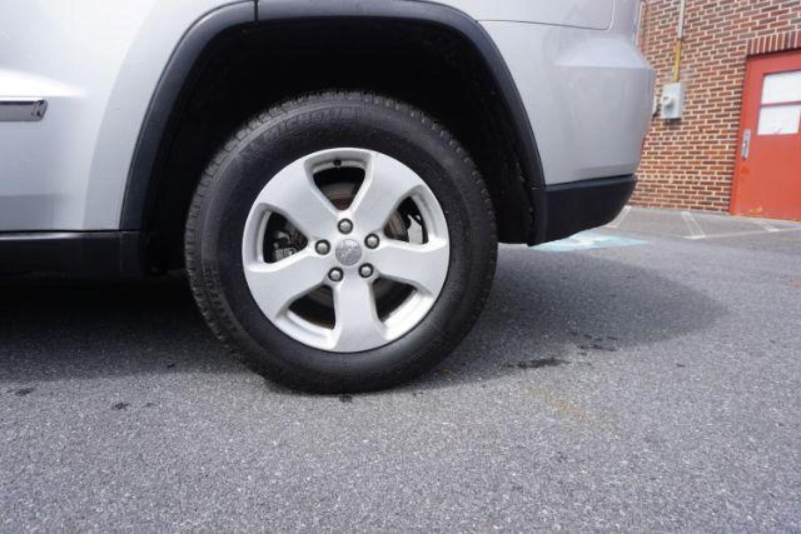 2012 Bright Silver Metallic /Black Leather Interior Jeep Grand Cherokee Laredo 4WD (1C4RJFAG2CC) with an 3.6L V6 DOHC 24V engine, 5-Speed Automatic transmission, located at 312 Centre Ave, Schuylkill Haven, PA, 17972, (570) 593-5278, 40.638130, -76.177383 - automatic climate control, back up camera, heated front seats, leather seats, navigation, power liftgate, rear parking sensors - Photo#4