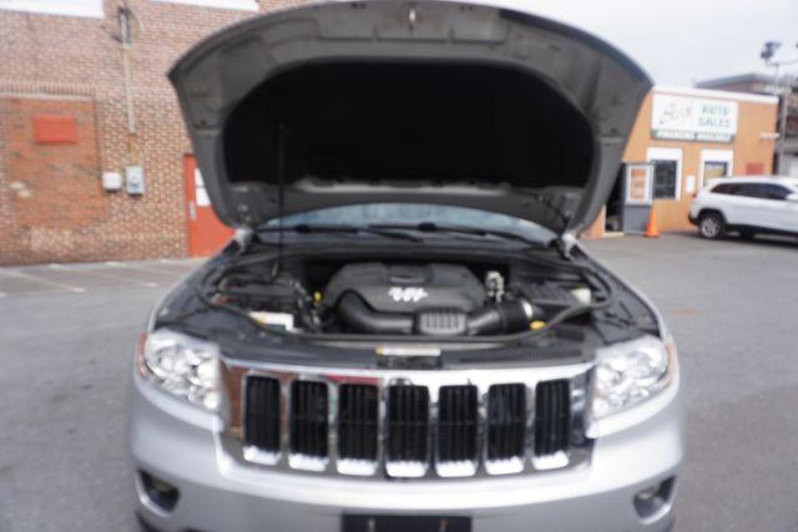 2012 Bright Silver Metallic /Black Leather Interior Jeep Grand Cherokee Laredo 4WD (1C4RJFAG2CC) with an 3.6L V6 DOHC 24V engine, 5-Speed Automatic transmission, located at 312 Centre Ave, Schuylkill Haven, PA, 17972, (570) 593-5278, 40.638130, -76.177383 - automatic climate control, back up camera, heated front seats, leather seats, navigation, power liftgate, rear parking sensors - Photo#58