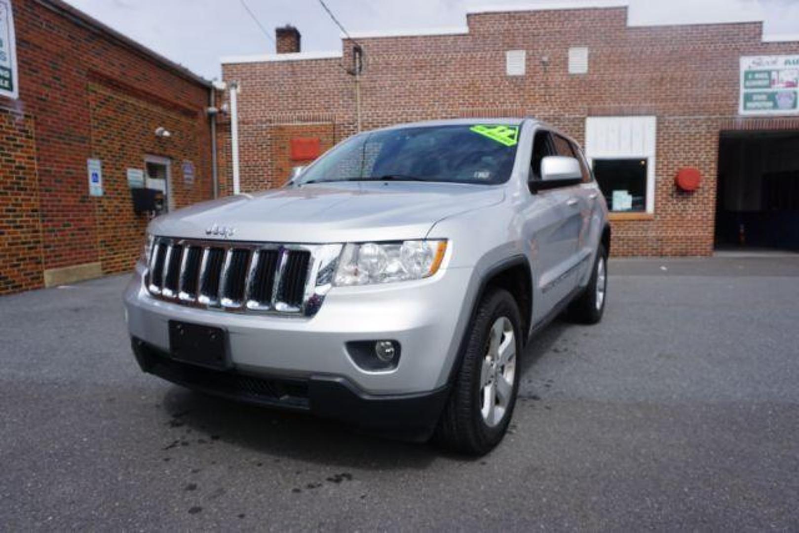 2012 Bright Silver Metallic /Black Leather Interior Jeep Grand Cherokee Laredo 4WD (1C4RJFAG2CC) with an 3.6L V6 DOHC 24V engine, 5-Speed Automatic transmission, located at 312 Centre Ave, Schuylkill Haven, PA, 17972, (570) 593-5278, 40.638130, -76.177383 - automatic climate control, back up camera, heated front seats, leather seats, navigation, power liftgate, rear parking sensors - Photo#5