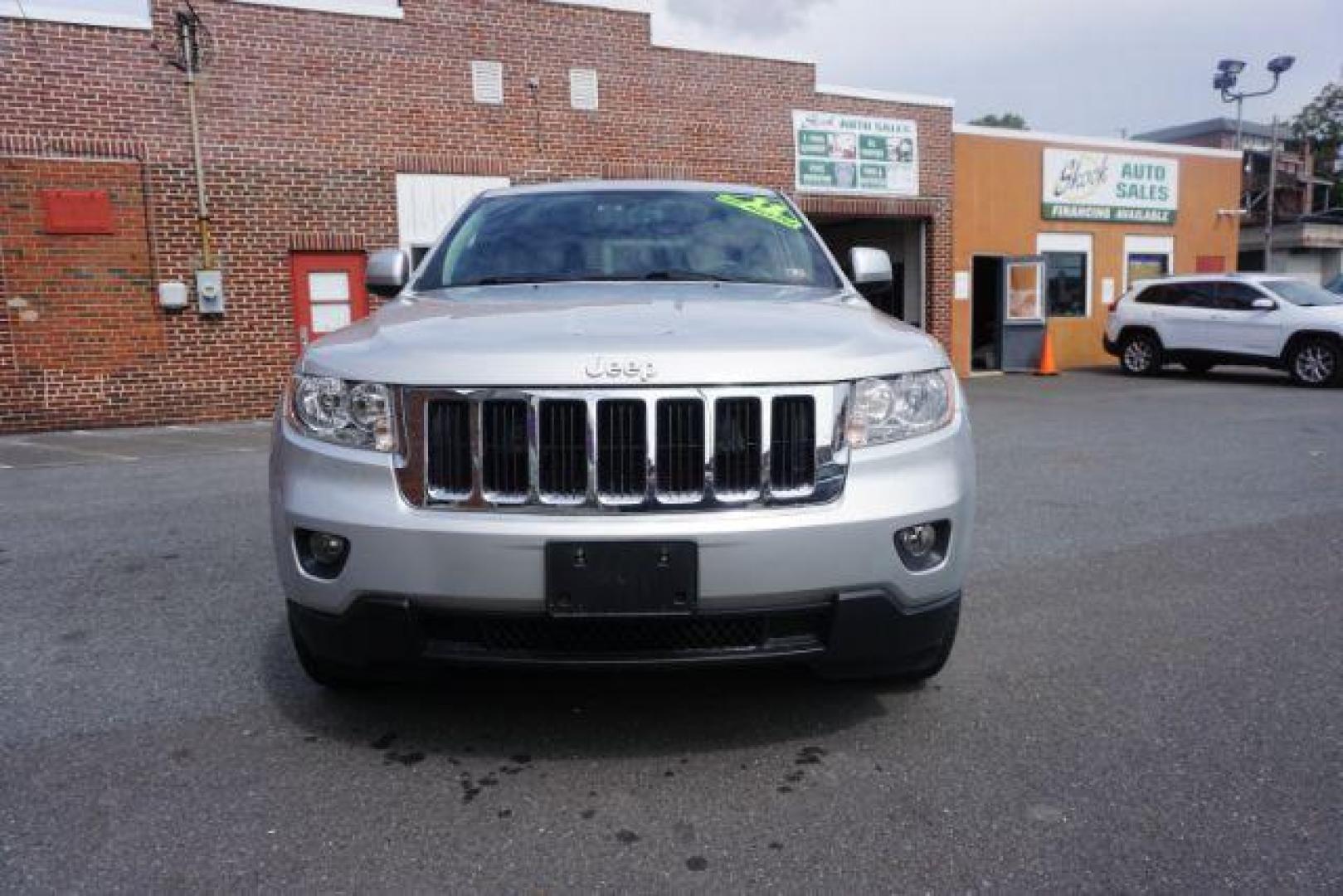 2012 Bright Silver Metallic /Black Leather Interior Jeep Grand Cherokee Laredo 4WD (1C4RJFAG2CC) with an 3.6L V6 DOHC 24V engine, 5-Speed Automatic transmission, located at 312 Centre Ave, Schuylkill Haven, PA, 17972, (570) 593-5278, 40.638130, -76.177383 - automatic climate control, back up camera, heated front seats, leather seats, navigation, power liftgate, rear parking sensors - Photo#6