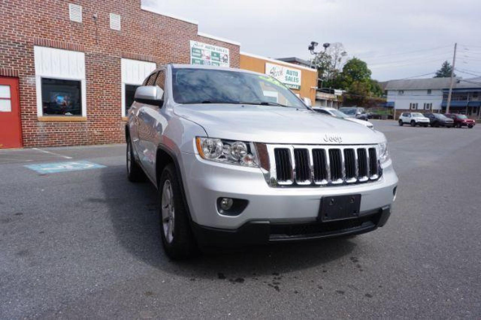 2012 Bright Silver Metallic /Black Leather Interior Jeep Grand Cherokee Laredo 4WD (1C4RJFAG2CC) with an 3.6L V6 DOHC 24V engine, 5-Speed Automatic transmission, located at 312 Centre Ave, Schuylkill Haven, PA, 17972, (570) 593-5278, 40.638130, -76.177383 - automatic climate control, back up camera, heated front seats, leather seats, navigation, power liftgate, rear parking sensors - Photo#7