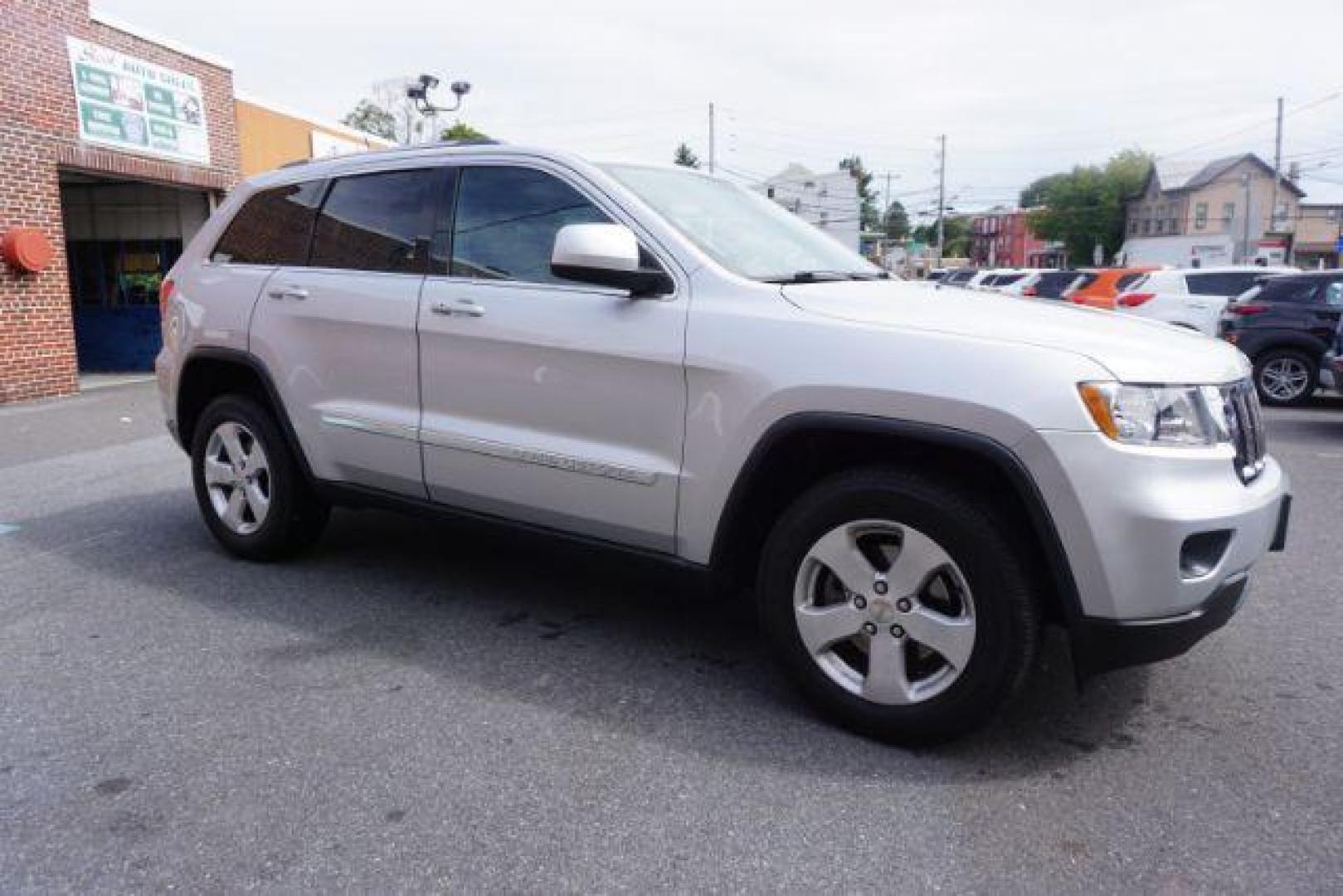 2012 Bright Silver Metallic /Black Leather Interior Jeep Grand Cherokee Laredo 4WD (1C4RJFAG2CC) with an 3.6L V6 DOHC 24V engine, 5-Speed Automatic transmission, located at 312 Centre Ave, Schuylkill Haven, PA, 17972, (570) 593-5278, 40.638130, -76.177383 - automatic climate control, back up camera, heated front seats, leather seats, navigation, power liftgate, rear parking sensors - Photo#8