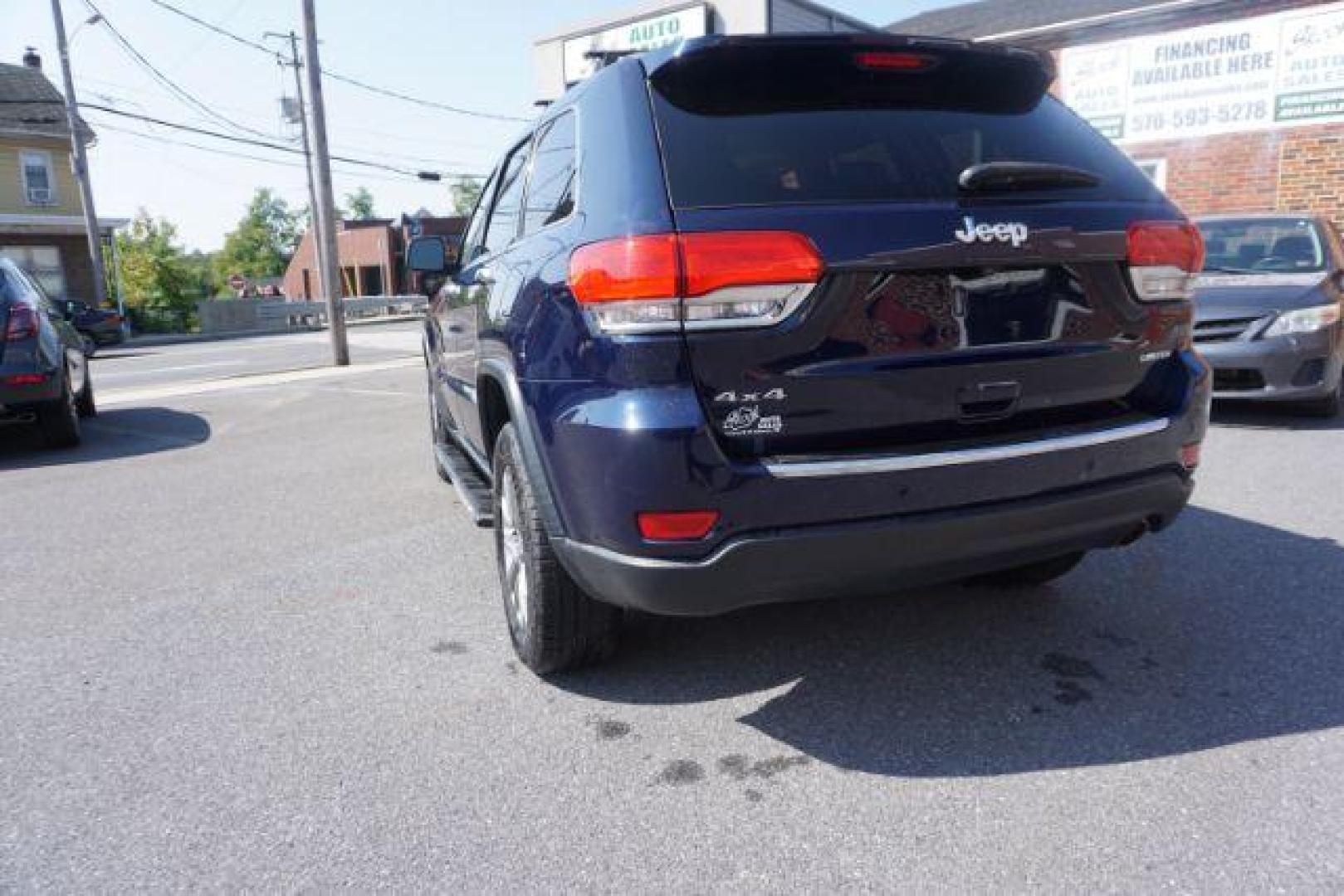 2015 True Blue Pearlcoat /Light Frost Beige/Black Jeep Grand Cherokee Limited 4WD (1C4RJFBG9FC) with an 3.6L V6 DOHC 24V engine, 8-Speed Automatic transmission, located at 312 Centre Ave, Schuylkill Haven, PA, 17972, (570) 593-5278, 40.638130, -76.177383 - adaptive cruise control, adv tech pkg, back up camera, blind spot monitor, collision avoidance system, heated front seats, lane departure warning, leather seats, navigation system, power liftgate, power sunroof, rear parking sensors, universal garage door opener - Photo#14