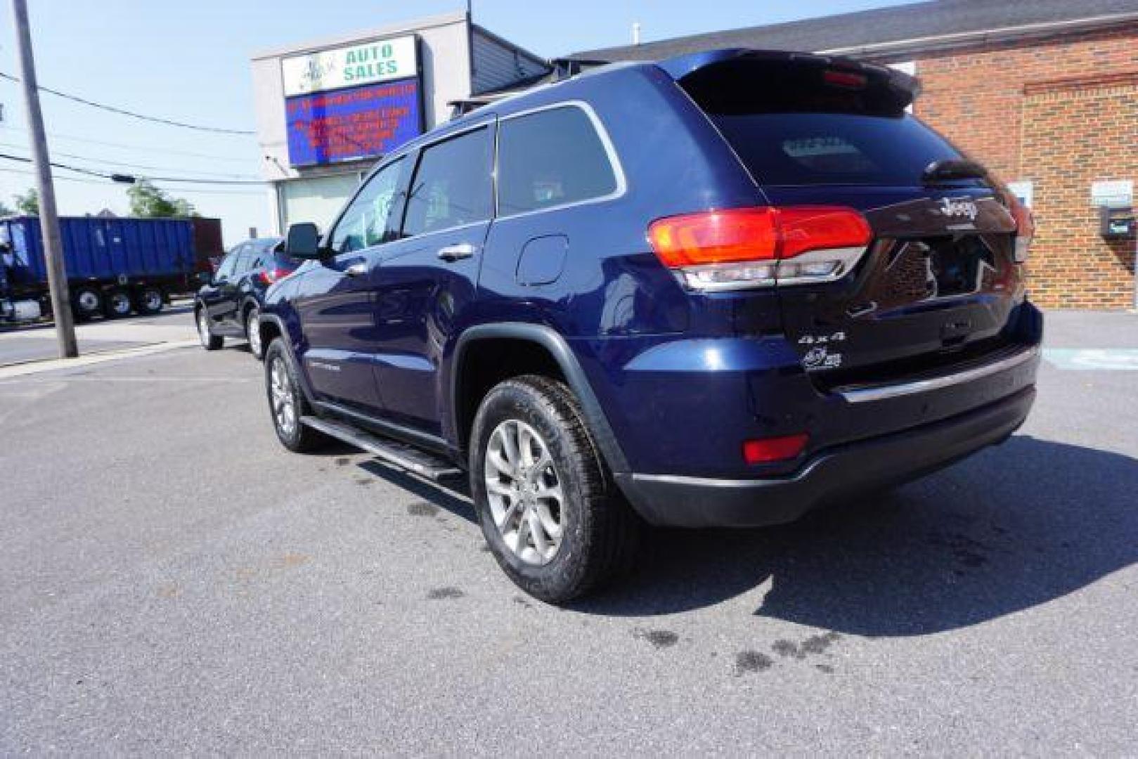 2015 True Blue Pearlcoat /Light Frost Beige/Black Jeep Grand Cherokee Limited 4WD (1C4RJFBG9FC) with an 3.6L V6 DOHC 24V engine, 8-Speed Automatic transmission, located at 312 Centre Ave, Schuylkill Haven, PA, 17972, (570) 593-5278, 40.638130, -76.177383 - adaptive cruise control, adv tech pkg, back up camera, blind spot monitor, collision avoidance system, heated front seats, lane departure warning, leather seats, navigation system, power liftgate, power sunroof, rear parking sensors, universal garage door opener - Photo#15