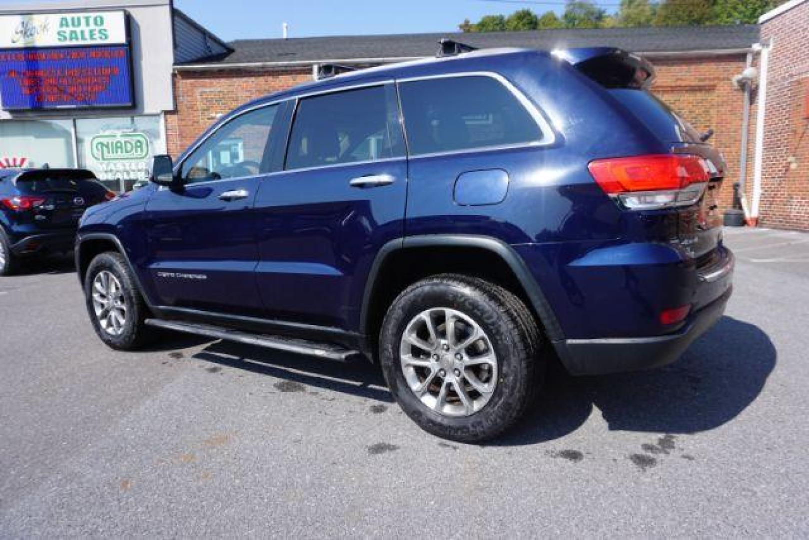 2015 True Blue Pearlcoat /Light Frost Beige/Black Jeep Grand Cherokee Limited 4WD (1C4RJFBG9FC) with an 3.6L V6 DOHC 24V engine, 8-Speed Automatic transmission, located at 312 Centre Ave, Schuylkill Haven, PA, 17972, (570) 593-5278, 40.638130, -76.177383 - adaptive cruise control, adv tech pkg, back up camera, blind spot monitor, collision avoidance system, heated front seats, lane departure warning, leather seats, navigation system, power liftgate, power sunroof, rear parking sensors, universal garage door opener - Photo#16