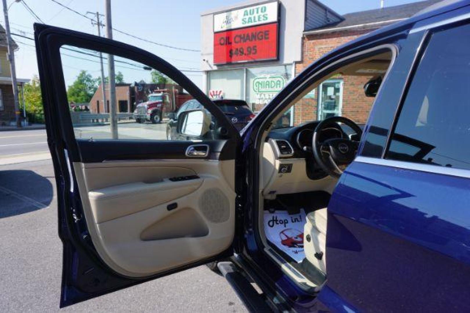 2015 True Blue Pearlcoat /Light Frost Beige/Black Jeep Grand Cherokee Limited 4WD (1C4RJFBG9FC) with an 3.6L V6 DOHC 24V engine, 8-Speed Automatic transmission, located at 312 Centre Ave, Schuylkill Haven, PA, 17972, (570) 593-5278, 40.638130, -76.177383 - adaptive cruise control, adv tech pkg, back up camera, blind spot monitor, collision avoidance system, heated front seats, lane departure warning, leather seats, navigation system, power liftgate, power sunroof, rear parking sensors, universal garage door opener - Photo#17