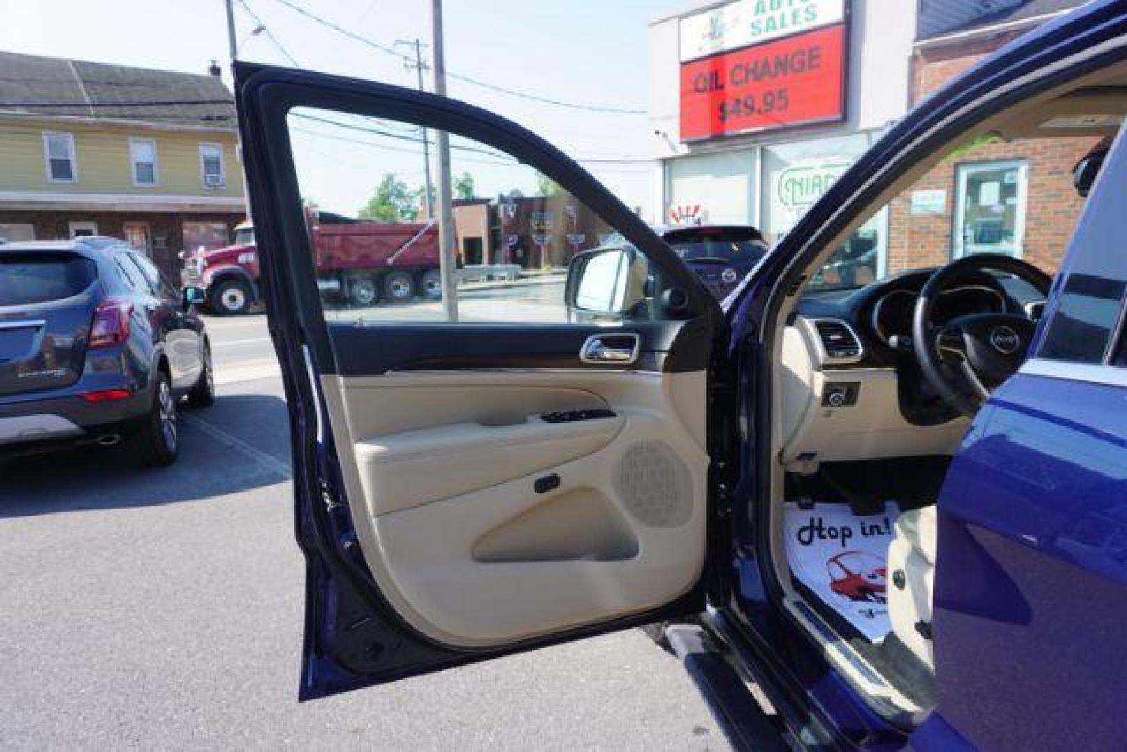 2015 True Blue Pearlcoat /Light Frost Beige/Black Jeep Grand Cherokee Limited 4WD (1C4RJFBG9FC) with an 3.6L V6 DOHC 24V engine, 8-Speed Automatic transmission, located at 312 Centre Ave, Schuylkill Haven, PA, 17972, (570) 593-5278, 40.638130, -76.177383 - adaptive cruise control, adv tech pkg, back up camera, blind spot monitor, collision avoidance system, heated front seats, lane departure warning, leather seats, navigation system, power liftgate, power sunroof, rear parking sensors, universal garage door opener - Photo#18