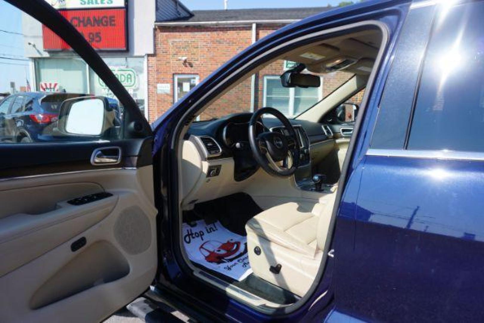 2015 True Blue Pearlcoat /Light Frost Beige/Black Jeep Grand Cherokee Limited 4WD (1C4RJFBG9FC) with an 3.6L V6 DOHC 24V engine, 8-Speed Automatic transmission, located at 312 Centre Ave, Schuylkill Haven, PA, 17972, (570) 593-5278, 40.638130, -76.177383 - adaptive cruise control, adv tech pkg, back up camera, blind spot monitor, collision avoidance system, heated front seats, lane departure warning, leather seats, navigation system, power liftgate, power sunroof, rear parking sensors, universal garage door opener - Photo#19