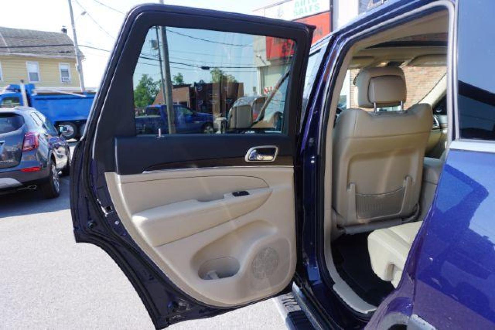 2015 True Blue Pearlcoat /Light Frost Beige/Black Jeep Grand Cherokee Limited 4WD (1C4RJFBG9FC) with an 3.6L V6 DOHC 24V engine, 8-Speed Automatic transmission, located at 312 Centre Ave, Schuylkill Haven, PA, 17972, (570) 593-5278, 40.638130, -76.177383 - adaptive cruise control, adv tech pkg, back up camera, blind spot monitor, collision avoidance system, heated front seats, lane departure warning, leather seats, navigation system, power liftgate, power sunroof, rear parking sensors, universal garage door opener - Photo#34